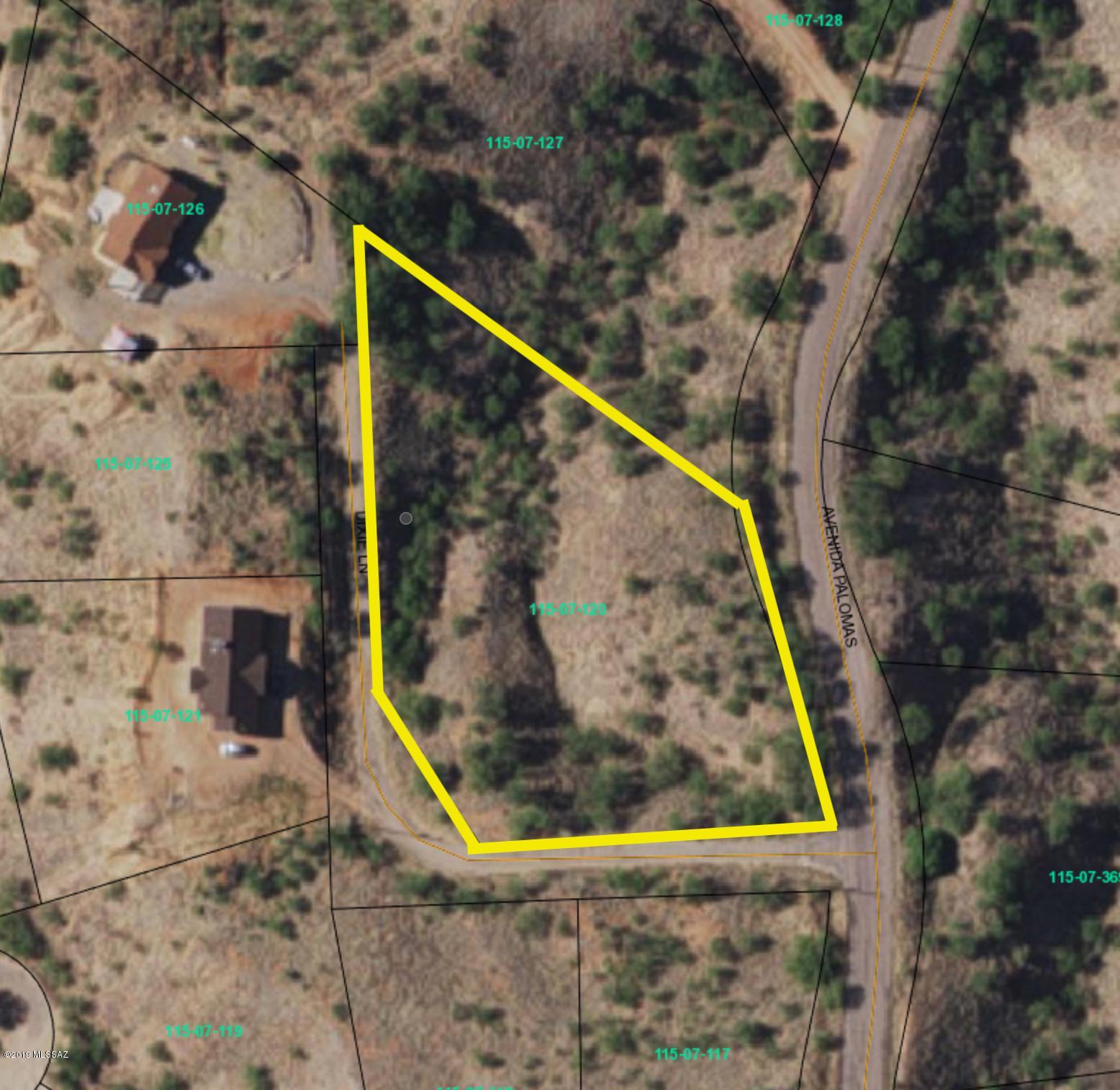 Steep hills. Great mountain views. Lot has a good spot to build. Paved Roads. Electric at street