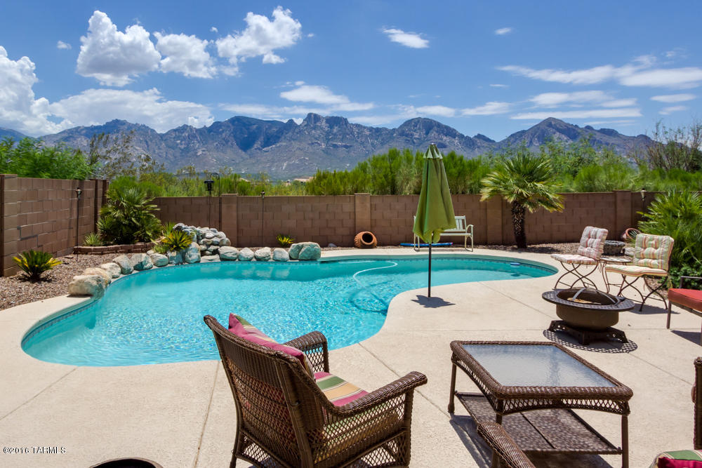 If you are looking for unobstructed Panoramic Catalina Mountain views - Look no more! Backyard entertaining with sparkling, heated pool & newly installed no-care turf w/mountain backdrop. Spacious open living area, ground floor master bedroom, bonus loft area upstairs. 4BR/2 1/2BA, granite counters, lots of cabinets, stainless appliances, pantry, casual dining & Breakfast bar. Formal Living/Dining area. Plantation shutters, ceramic tile & soaring ceilings & fans. Bonus loft area upstairs. Family room off kitchen has fireplace. 3 car garage w/built in storage cabinets & epoxy coated floor. Great Rancho Vistoso location with Shopping, Restaurants, Theaters & hospital nearby. Fabulous home for the most discriminating buyer seeking Spectacular Mountain views second to none!