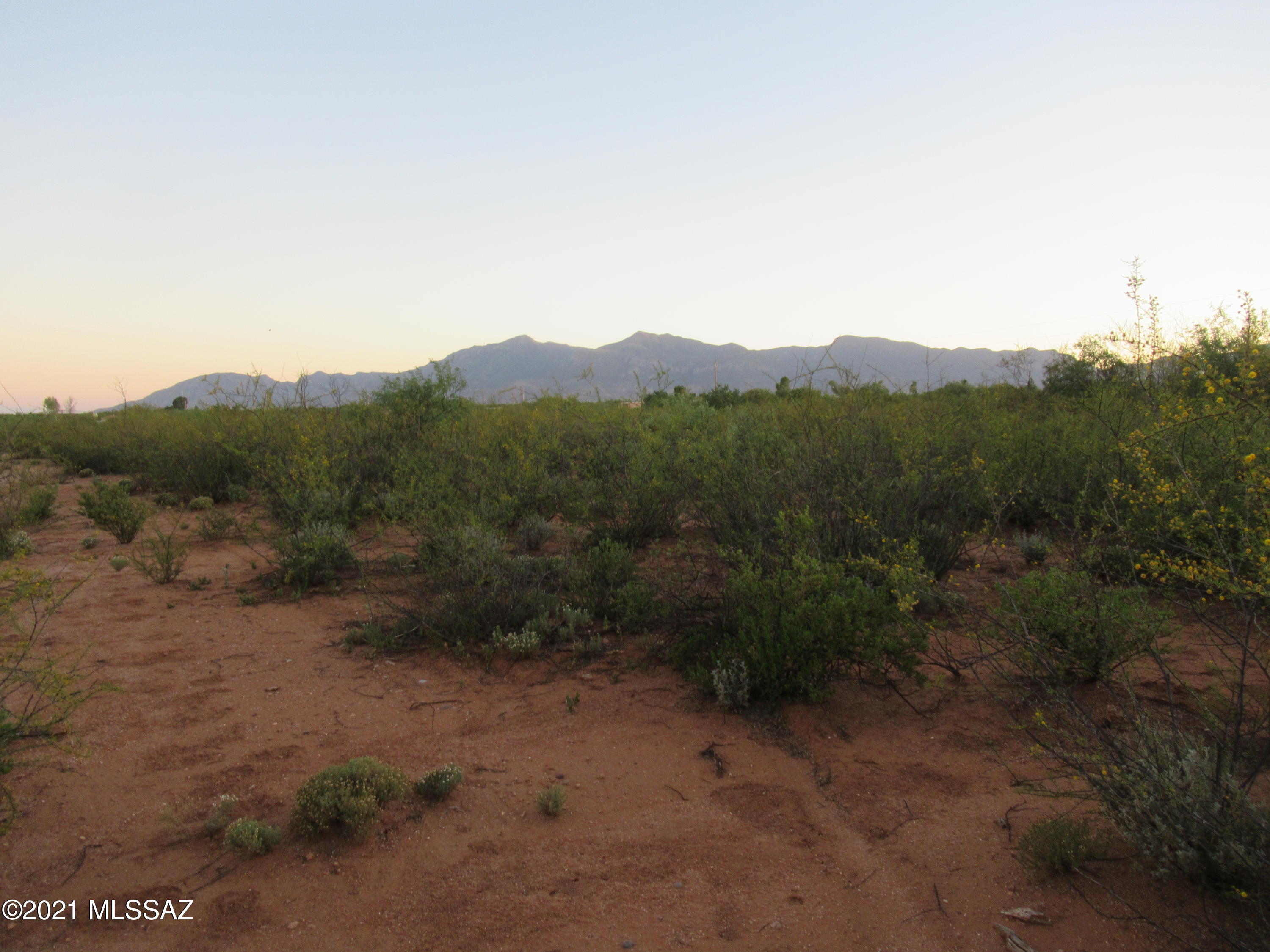 5 .03 Acres in private setting at the end of Road. AWESOME mountain views! HORSE property. Wire fencing on three sides.  BLM & State land nearby.  NO HOA!  Not in flood zone.  Perfect for site built or manufactured home. Plenty of room to build that dream workshop, garages, barns or whatever is on that wish list!  Mesquite trees and other plantings can be manicured to create your own park.  Electric within 200 ft.  Requires well & septic.  Shopping, schools, Fort Huachuca, and Canyon Vista Medical Center all less than 10 mile radius. Come visit Sierra Vista which boasts a wonderful climate and is hummingbird capital of Arizona.  This property might be that little corner of the earth you are seeking.  Owner licensed real estate agent in Arizona