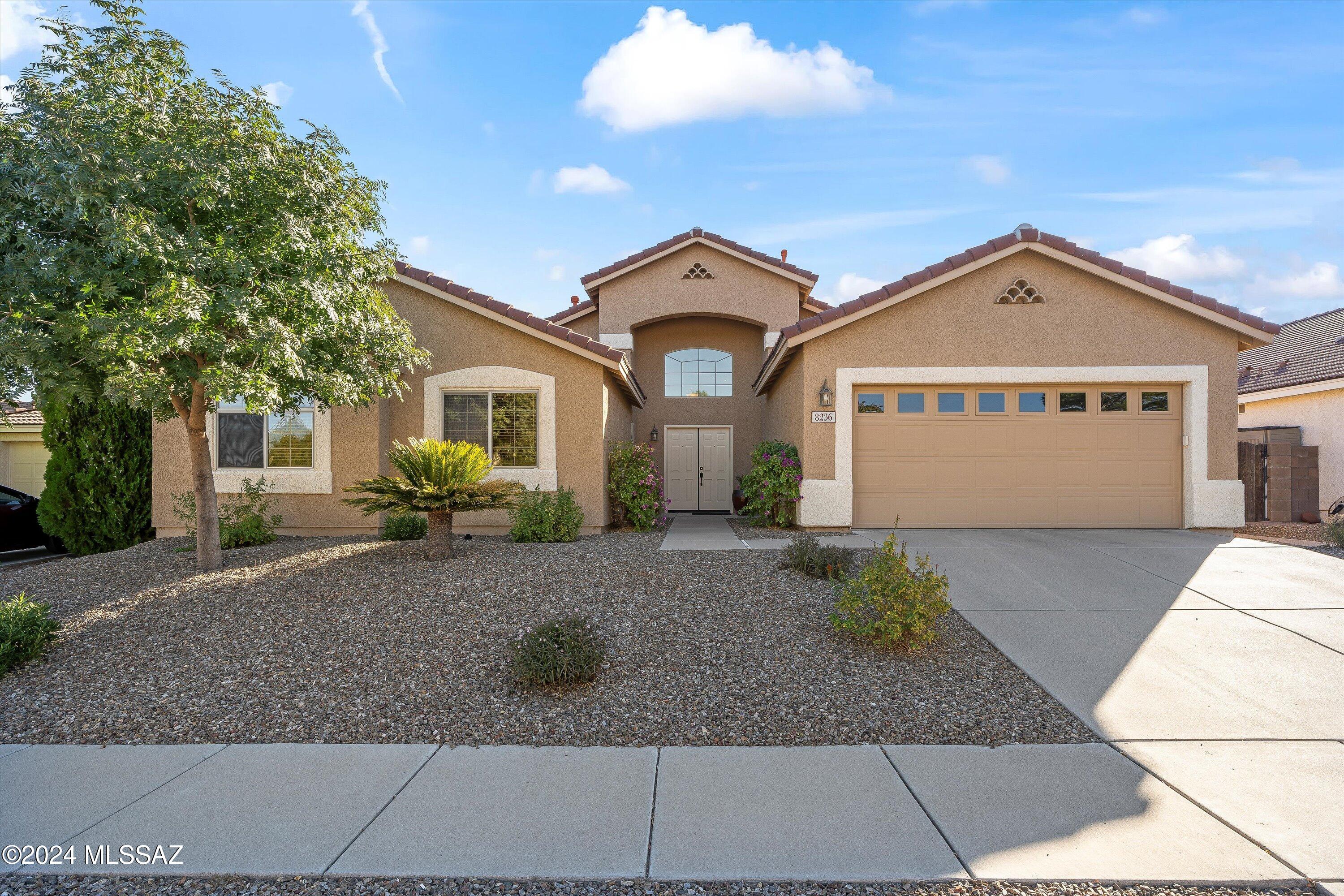 Spacious one-story 4 bedroom/2 bath home on Tucson's desirable east side! Built in 1999 and meticulously maintained, this 2,236 sq.ft. gem features high ceilings and an open floor plan. The inviting family room with a gas fireplace flows seamlessly into the dining area and kitchen, perfect for gatherings. The large living room off the entry has built-in cabinetry and overlooks the covered patio and backyard. Recent updates include a new tile roof and exterior paint. The .22-acre cul-de-sac lot offers a grass yard and a large covered patio, ideal for pets, kids, or entertaining. The laundry room has shelving and space for a full-size side-by-side washer and dryer. This is a home that shows pride of ownership. All you need to do is move in!