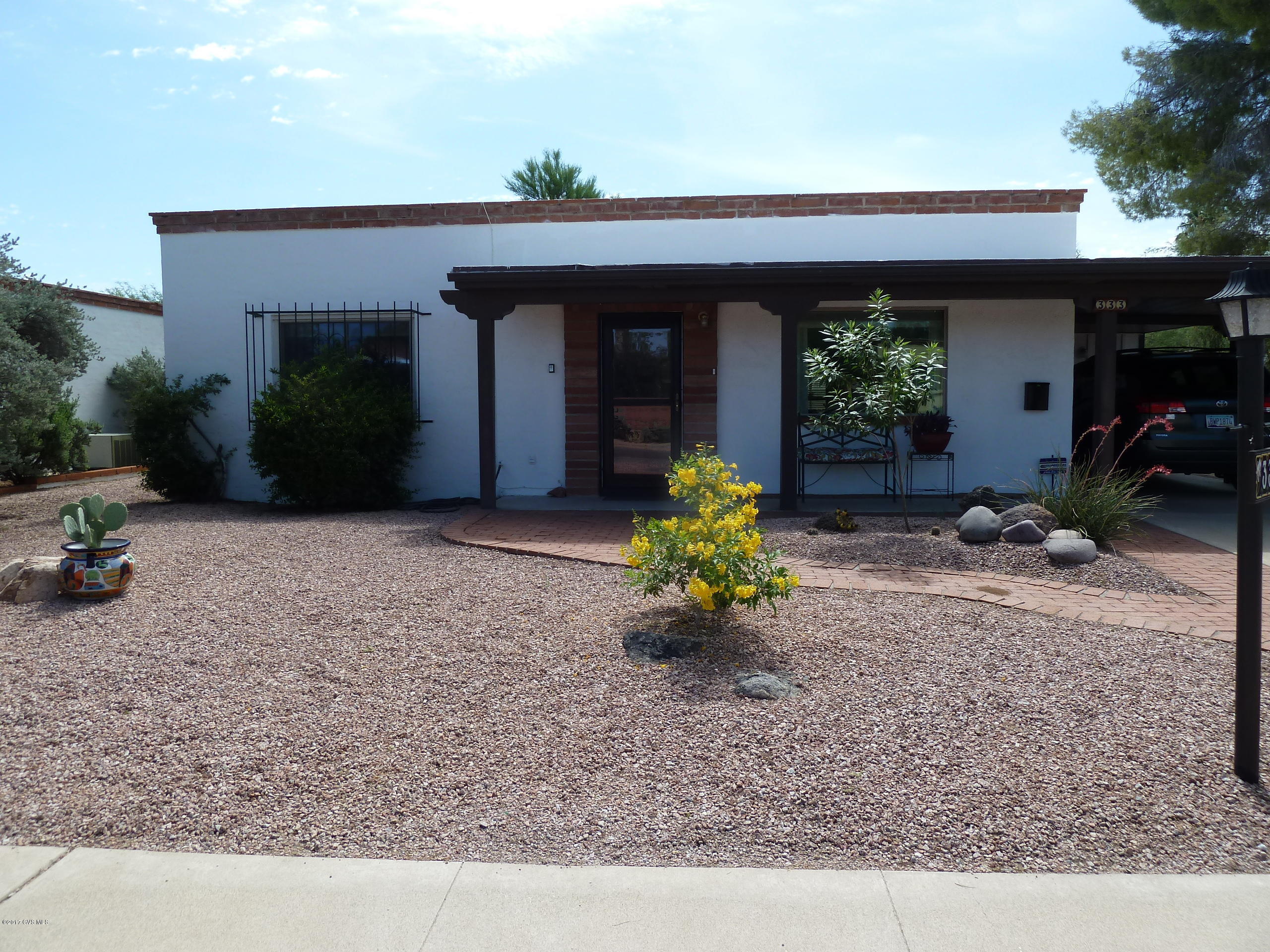 This well maintained home is neat as a pin and move-in ready. Many great features include all wood being covered by maintenance-free metal siding, dual pane windows, newer HVAC and AZ room with lots of windows making it light and bright. Exterior painted in 2014. Beautifully manicured landscaping front and back with multiple patio areas in back with large wall for privacy. Close to the East GVR center and Haven Golf Course.