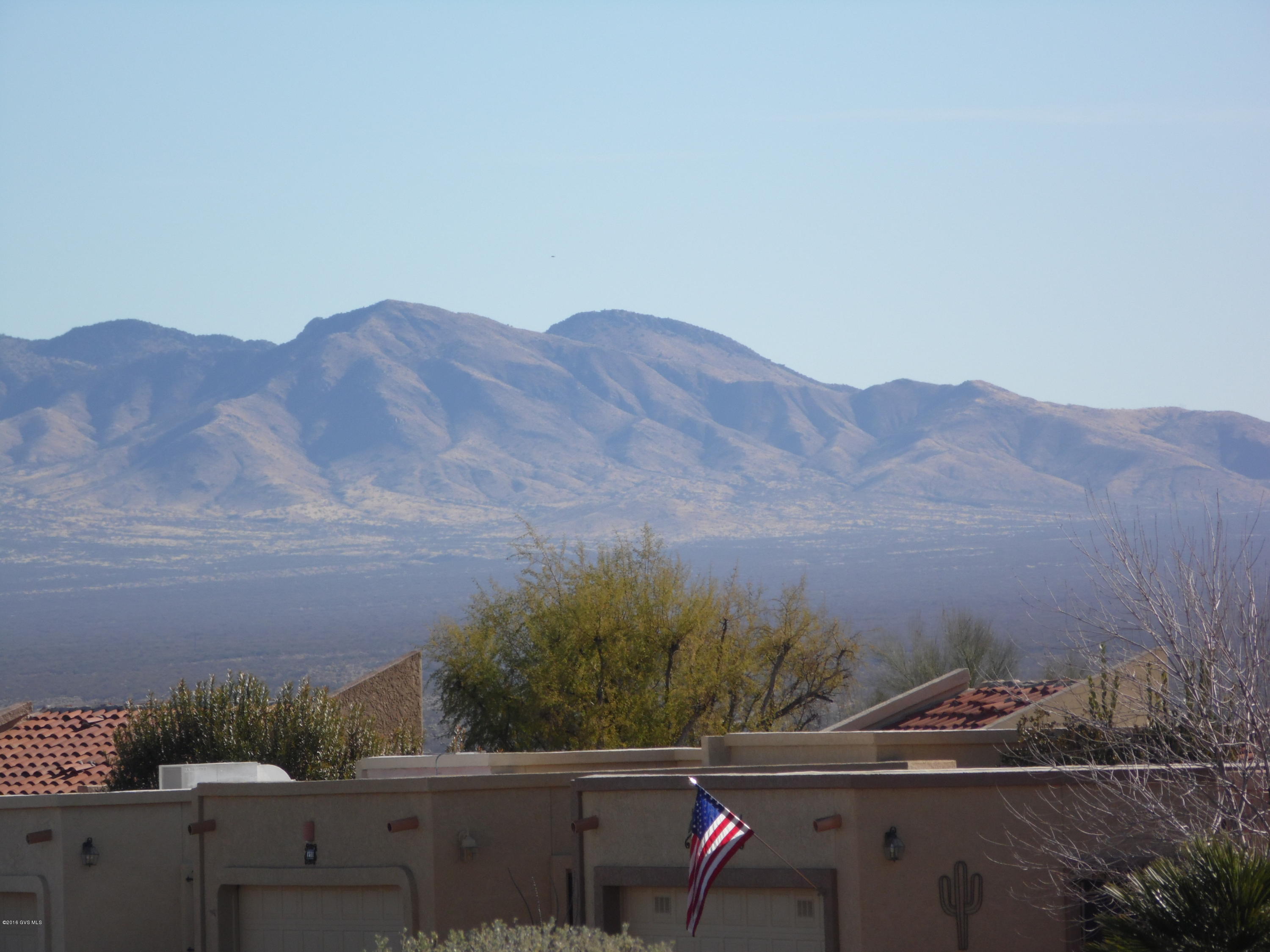MAGNIFICENT VIEWS OF SANTA RITA MOUNTAINS FROM INSIDE AND BACK COVERED PATIO, THIS POPULAR EL NOPAL FLOOR PLAN FEATURES A FOYER ENTRY, EAT IN KITCHEN WITH GARDEN WINDOW, TWO BEDROOMS AND TWO BATHS, NICE CLOSET SPACE AND BUILT IN SHELVING IN LIVING ROOM & GUEST BEDROOM (CAN BE REMOVED) END UNIT FEATURES EXTRA WIND IN LIVING ROOM AND KITCHEN. ONE CAR GARAGE