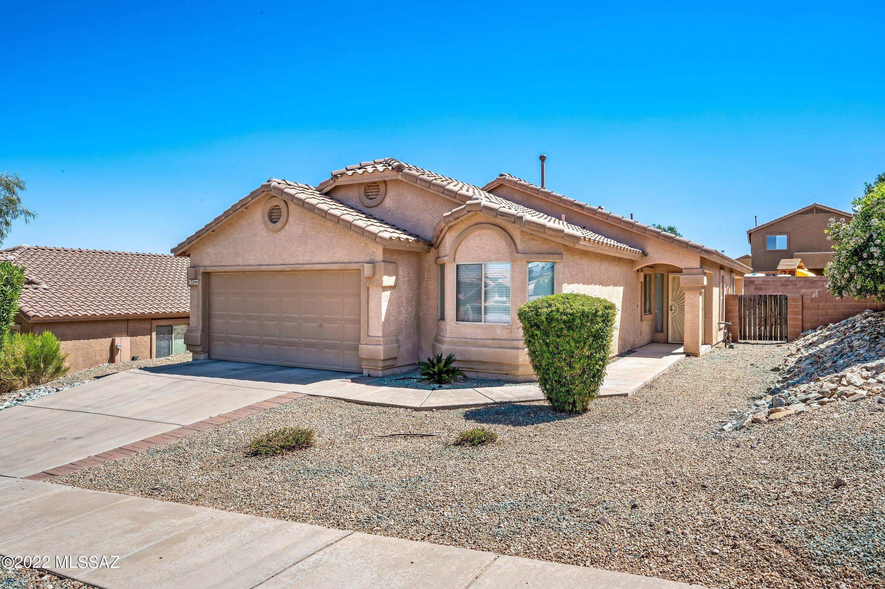 Beautiful home in Vail school district. Open room concept with breakfast bar in kitchen and fireplace in living room. Large backyard with patio and extended pavers. Epoxy garage.