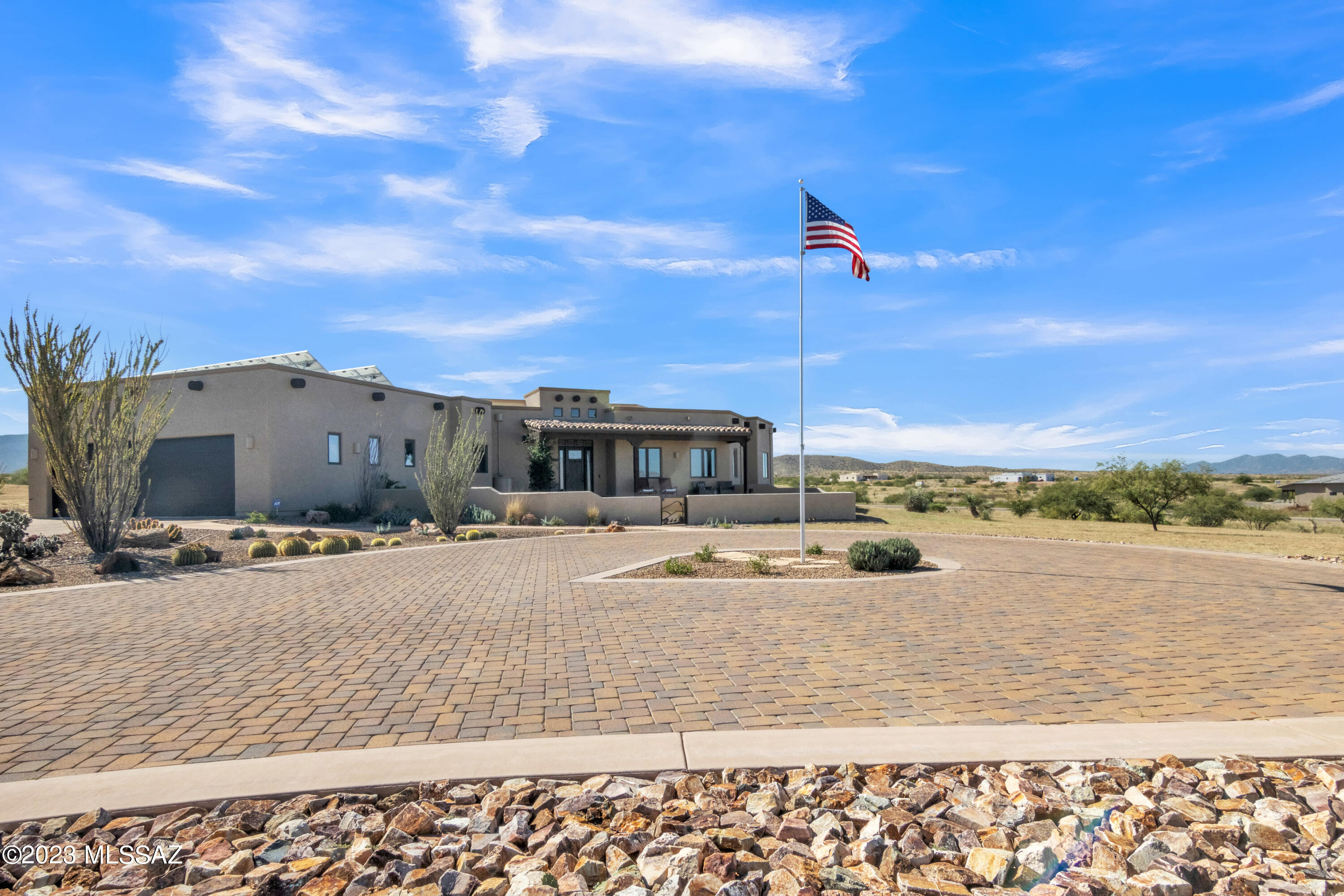 Captivating Mountain-View Oasis in Redhawk at J-Six Ranch

Nestled on a peaceful cul-de-sac lot within the beautiful Redhawk at J-Six Ranch community, this magnificent 3-bedroom, 2.5-bath custom home sits on 4.5 acres of tranquil desert beauty. Built in 2012, this 2,784 Sq ft split floor-plan home offers an array of exceptional features:

Colored concrete floors, knotty alder doors, and Cherry Cabinetry.
Pella Casement windows for abundant natural light.
Stainless steel appliances in the well-appointed kitchen.
Ceiling fans throughout for added comfort.
Extra-large 3-car garage with a 4.32 kVA PV solar array atop for reduced electric bills
Exercise/Bonus Room
Step outside, and you'll discover an entertainer's dream backyard, complete with a solar-heated, saltwater lap pool, three inviting seating areas, a putting green, built-in barbecue grill, and an outdoor fireplace. Immerse yourself in the peaceful Arizona evenings and make memories with loved ones.

Additional features that set this property apart:

1,200-gallon rainwater collection system.
1,000-gallon graywater capture tank.
Whole-house humidifier for added comfort.
Dual heat pumps for efficient climate control.
Exterior painted in Feb 2023; roof coated in Nov 2020.
Roof insulated to an R-Value of 49.
400-amp electric service.
Included 196 sq ft Shed for extra storage needs.
Adjacent 3 Acre Lot Opportunity: Take advantage of the adjacent 3-acre lot (#248) available for sale. The seller offers favorable pricing if purchased together with this stunning property.

Don't miss your chance to experience the Arizona lifestyle at its finest. Contact us today to schedule a viewing and make this captivating oasis your own.