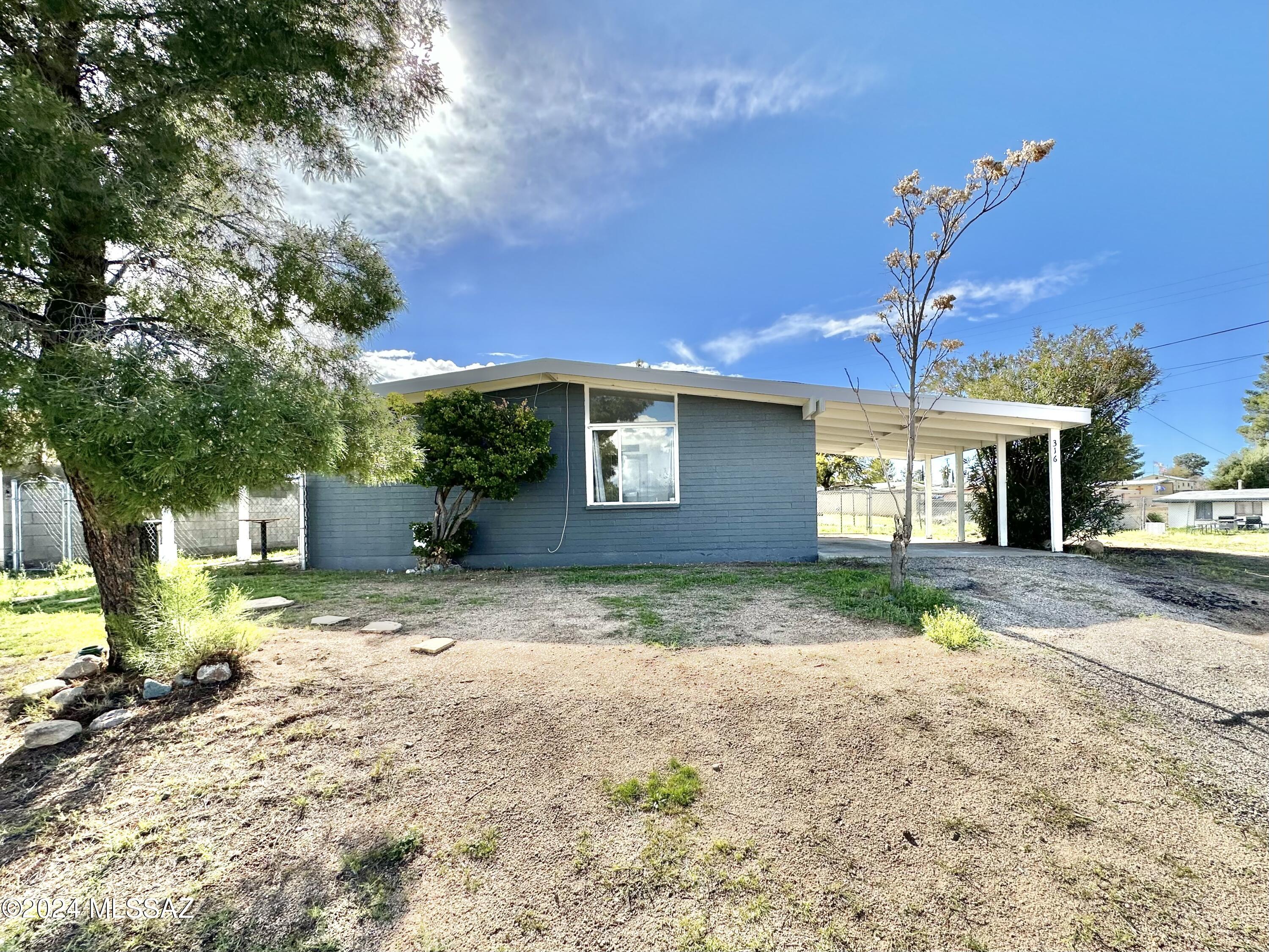 Remodeled 2-bed 1-bath home, available for move-in right away! Interior features tile flooring and stainless steel fridge, gas range, microwave & dishwasher are included. Kitchen also features a large walk-in pantry. The large corner lot has a fenced-in backyard,  with washer and dryer hook ups on back porch. Owner pays the monthly sewer bill, but tenant pays all other utilities.