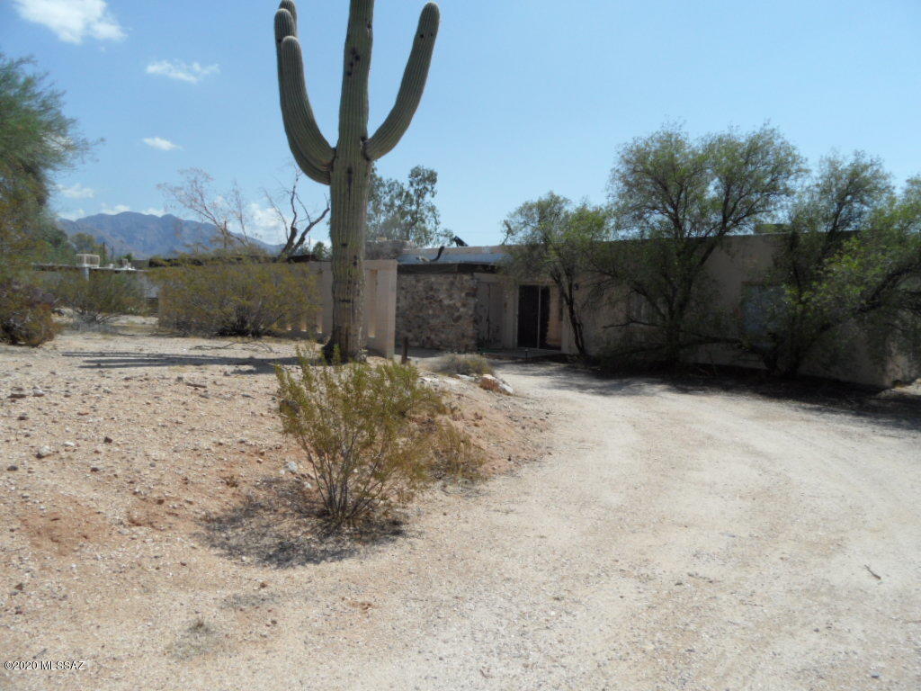 Well established neighborhood of Casas Adobes in NW Tucson. Almost 2100 sq ft, this classic home features 4 bedrooms, 2 baths, large back yard with conventional pool, plenty of space for outdoor BBQ, trees, RV storage and an enclosed backyard patio. Many possibilities for indoor and outdoor space design. Owned solar panels heat the electric wafer heater. No HOA!