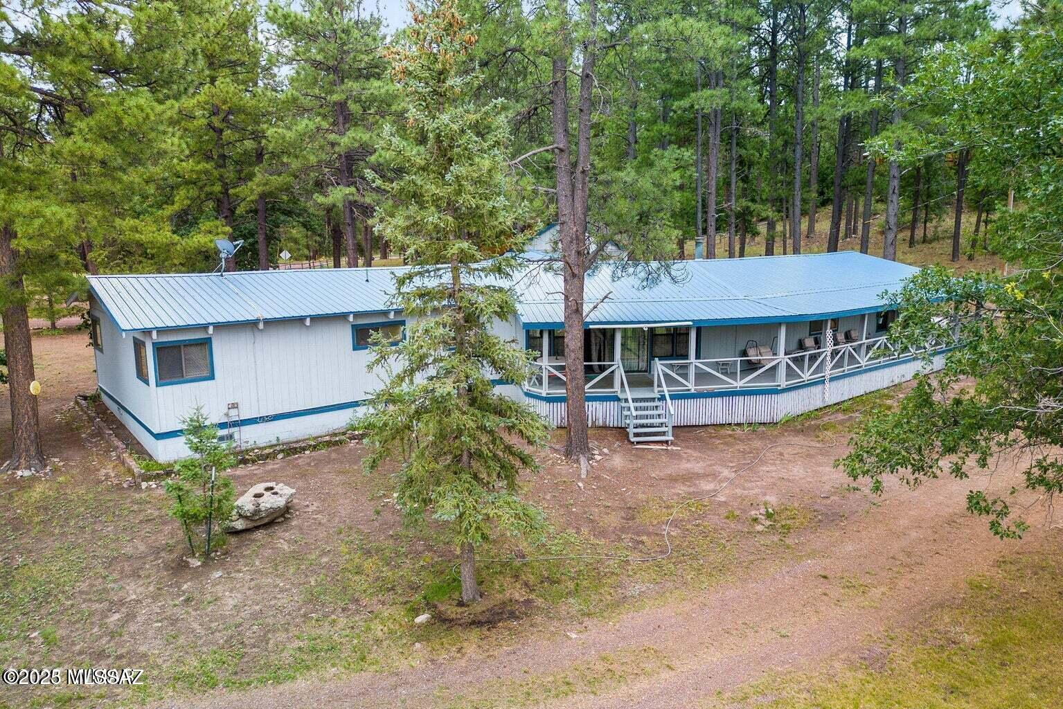 3,597 Sq.ft. 3 BD/2 BA home located in the Alpine Country Club Estates overlooking the No. 9 Fairway and Green on a 1.59 forested acre parcel with mountain views. Features a Living Room/Family Room with a double-sided fireplace with a wood burning insert on one side and a wood burning fireplace on the other side; kitchen/dining room combination; library with a wet-bar area; large recreation/pool table room with fireplace; utility/pantry room. Detached 3 car garage with storage room. Covered front porch; and enjoy the views from the covered back deck.