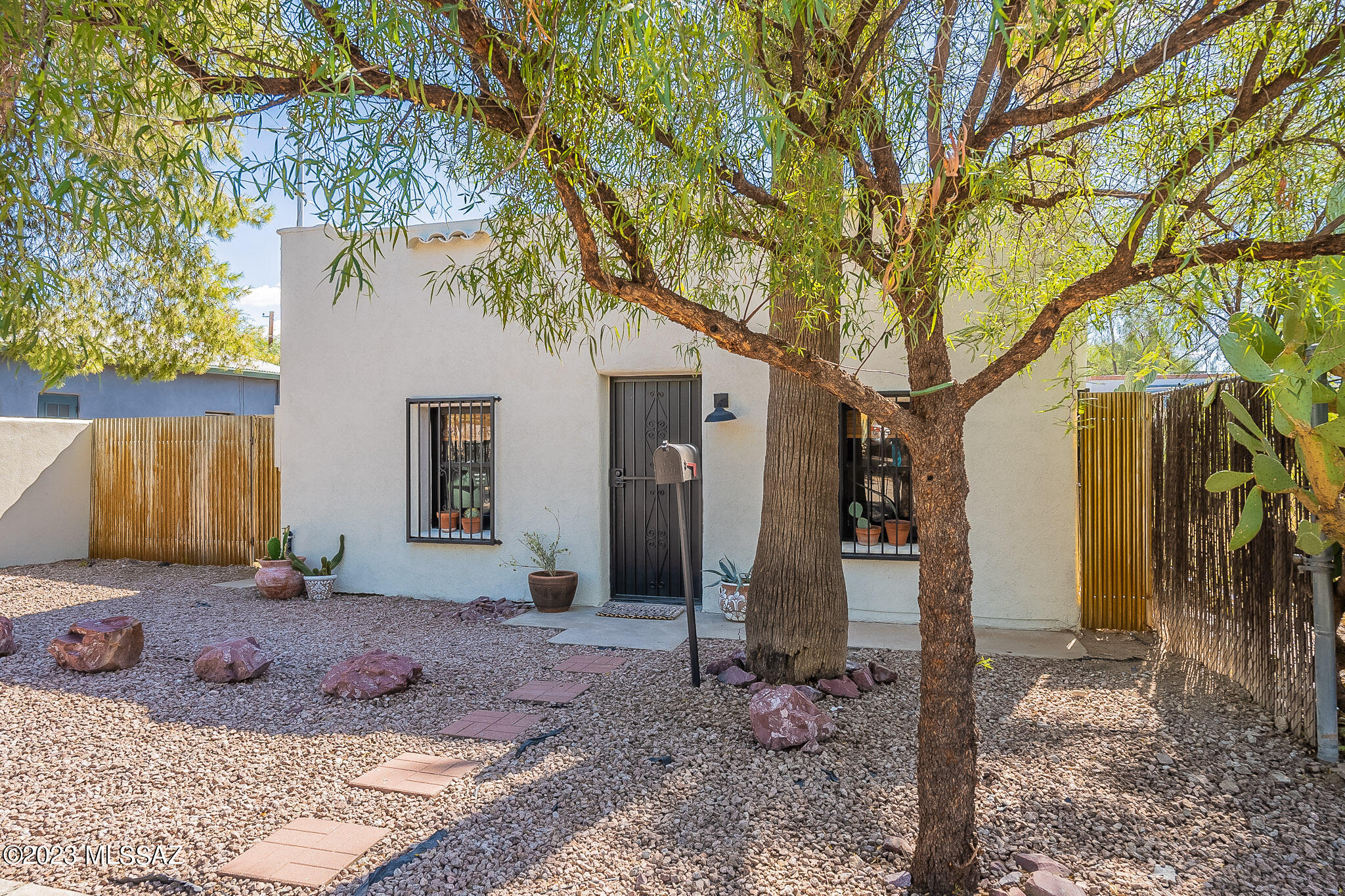Charming, fully remodeled Barrio Bungalow in Vibrant Downtown! Step inside this enchanting home where the warm & inviting atmosphere will immediately make you feel at ease. The living room is bathed in natural light & amazing kitchen boasts modern amenities for all your culinary needs. Both bedrooms offer peaceful retreats w/one having private patio access. Bright & spacious bath w/beautiful custom tiled walk-in shower & plenty of storage. Expansive lot w/off street parking, huge covered patio offering endless opportunities for outdoor gatherings, gardening & relaxation. Off street parking in back & bonus studio/workshop could easily be garage or guest house. Quick walking access to local shops, parks & public transit! Property offered for a limited time. Owner is licensed agent in AZ.