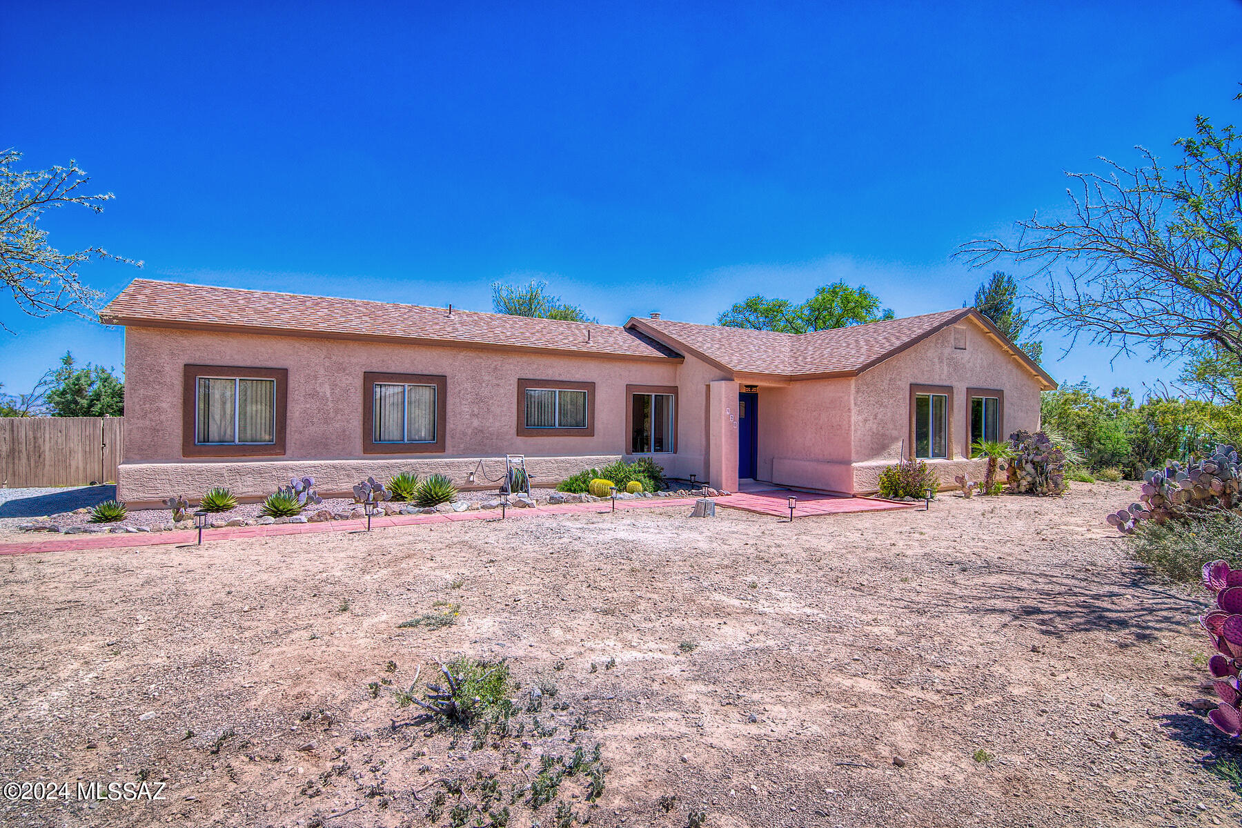 Wow, This spectacular home is located on one of the best lots in the area.   This 1.1 acre lot has tremendous Catalina and Rincon mountain views. Many upgraded features in the home.  Newer floor tiles throughout the house, newer commercial grade septic system, new roof install in 2016 with high quality 50 year storm resistant shingles and a New HVAC system installed in 2021. The kitchen has new stainless steel appliances to included: microwave, range and dishwasher. New quartz countertops, undermount sink and white cabinetry. The bathrooms have been remodeled with new quartz countertops, faucets, fixtures, framed mirror, tile surround in the showers and undermount sinks. Two laundry hookups: one in the house and one in the garage. The two car garage is well insulated and has water and electric for a possible family room or bedroom addition. There is a large decked area above the garage ceiling for storage. The fenced backyard has privacy with shaded canopies of many mature trees, citrus, flowering shrubs and natural desert vegetation.
The Large tree-lined sandy wash at property edge provides extended natural desert ambiance and is a great place to walk and enjoy nature. The 6-foot no-climb fence around a large portion of the backyard includes a rolling gate at the driveway and three additional gates. Built-in fire pit and backyard irrigation system.
No HOA so bring all of your toys, RV parking, boats, horses and more. NO POLY PIPES
Award Winning Vail Schools.