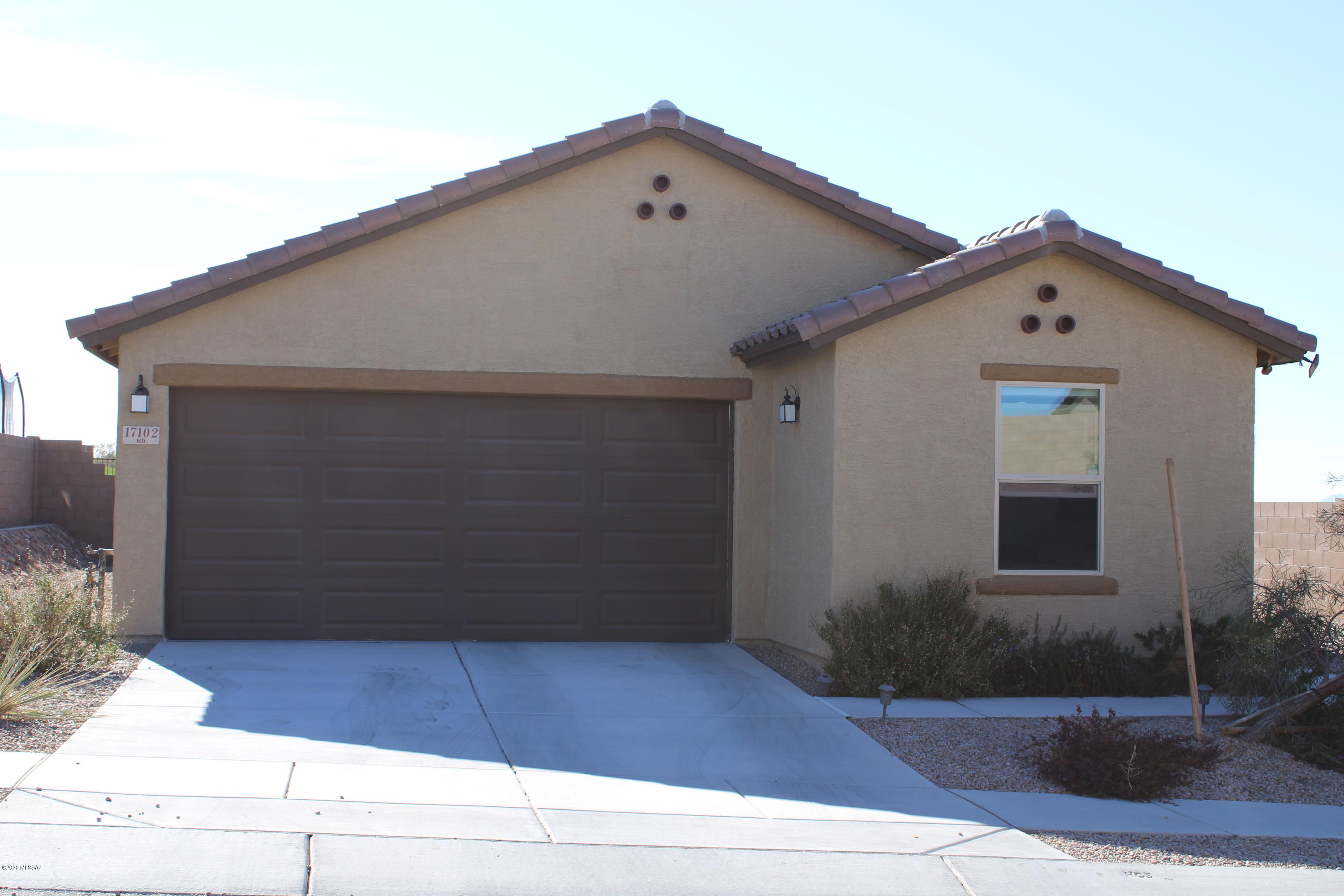 Almost new home! Open great room concept with dining area, breakfast bar kitchen island, slate/stainless steel kitchen appliances, split bedroom plan, den (for office or kid's play area) and finished backyard! Smart fridge has Keurig adapter for the coffee lover too! 20x20 tile throughout, except bedrooms. Solar system, automation smart features, cell phone booster - just what a techie wants! Backyard features separate dog run; no rear neighbors; spa and gazebo; view fencing with desert/mountain views. Water softener loop in garage. Washer/Dryer convey too! Your new Casa in the Desert awaits! Come see it today!