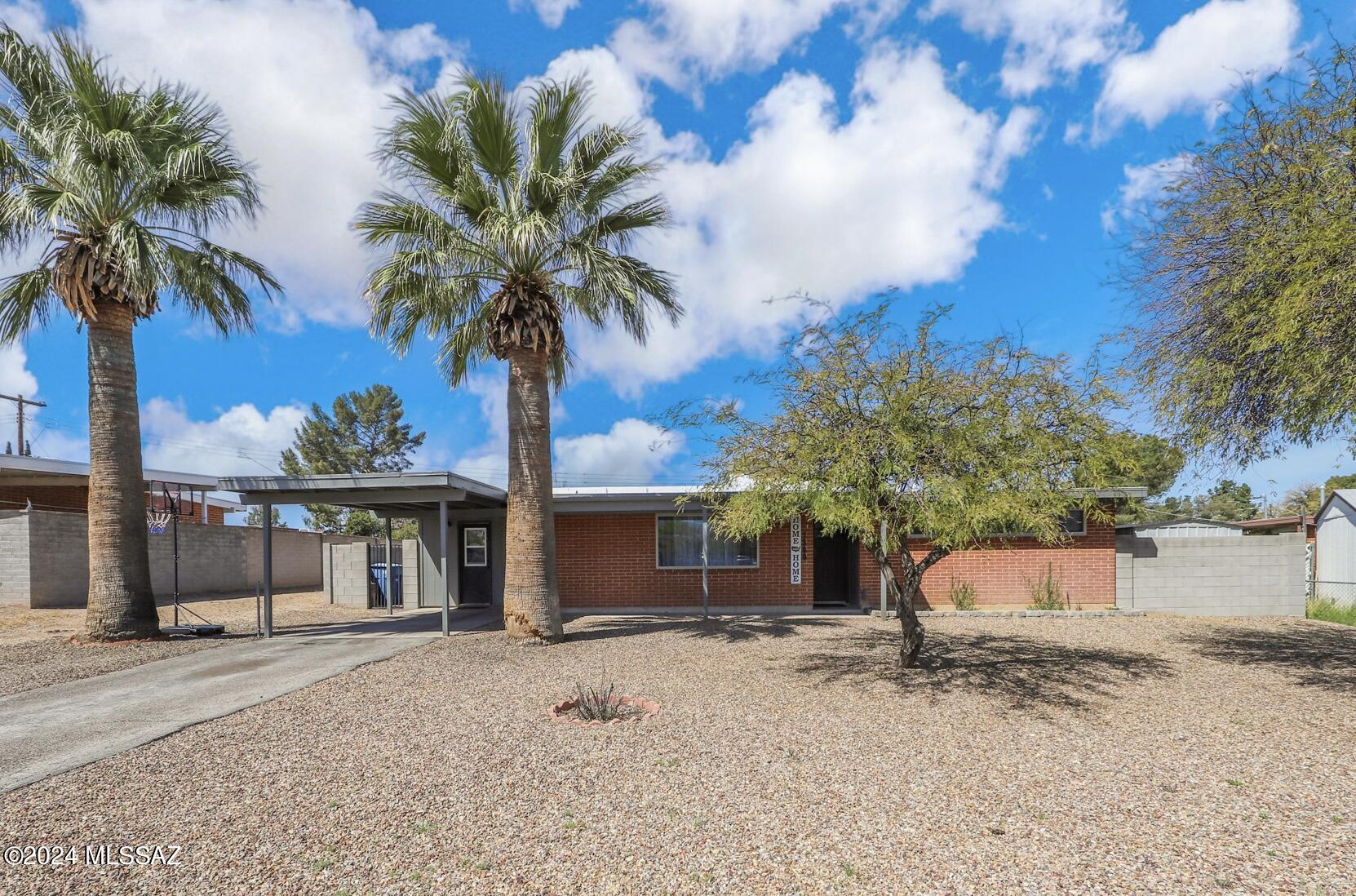Seller to accept/counter within range. $350,000-$365,000. Welcome home! This beautifully updated east side gem boasts 3 bedrooms, a den, & a versatile bonus room that can easily become a spacious walk-in closet to convert the den into a cozy 4th bedroom. The stunning kitchen offers a taste of modern elegance with two-toned cabinetry, granite countertops, black hexagon tile backsplash & stainless steel appliances. Throughout the home, you'll find tasteful black accents & fixtures, vinyl flooring, dual pane windows offering abundant natural light and recessed lighting. The backyard offers, a sparkling pool, inviting turf area with play set, & stunning mountain views. Privacy is ensured w/ the new block wall surrounding the backyard.  Newer AC. This home truly has it all!