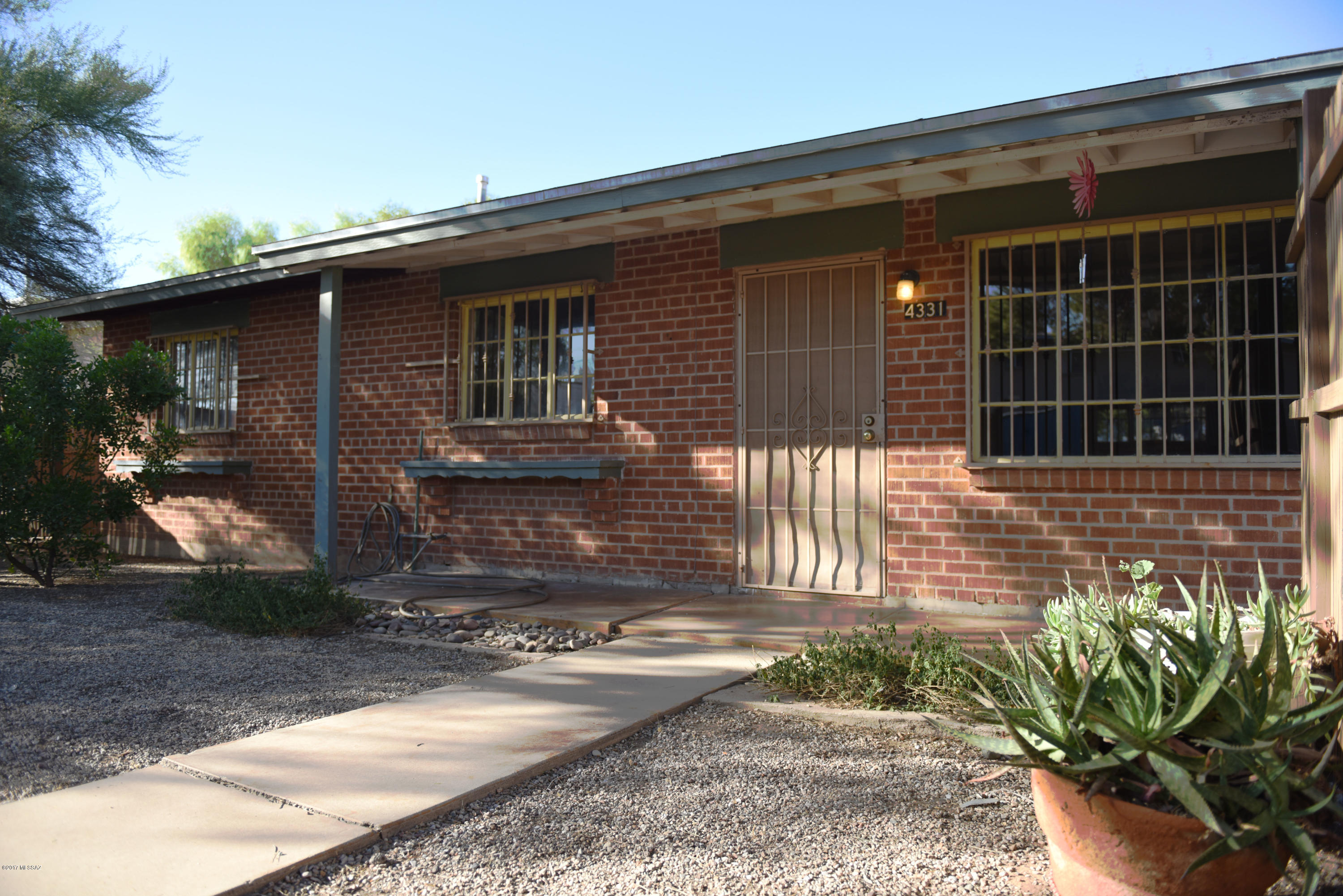 This Centrally located 3 bedroom 1 bathroom house is ready for its new owners!  Recently remodeled, this house has brand new wood floors throughout, all new appliances, new cabinets and counter tops, and much more.  Relax with the central AC inside or step out into the fully screened Arizona Room to enjoy Tucson’s beautiful weather.  Backyard is completely fenced and has several mature trees providing plenty of shade.  There is even a small shed to store any of your extra items!