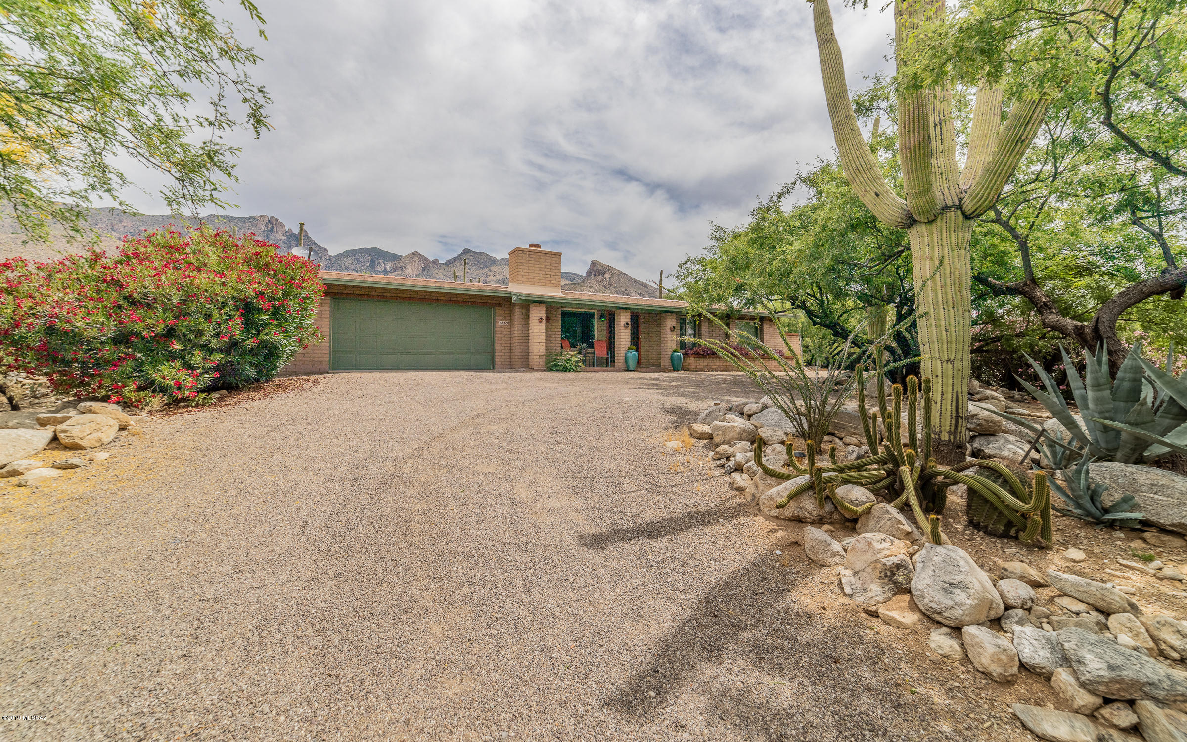 Great home in the much sought after Foothills Clusters. Foothills living, District 16, a pool & mountain views at an affordable cost. Relax in the oasis feel of your new backyard w/ ramada covered paver patio. Swim in your beautiful, well cared for pool (serviced weekly). Landscaping is compete with fruit producing pomegranate tree and many other desert plants and irrigation system. Walk up to the pool where the mountains feel like they are close enough to touch through the slump block/view fencing. Newer heater (Trane), A/C, Levelor Blinds.  Hall bath completely redone with its own linen closet. Oversized master bedroom w/ large walk-in closet and giant bath. Saltillo tile in dining room, sun room and kitchen. New carpet in living room, hall and bedrooms. Complete interior freshly paint