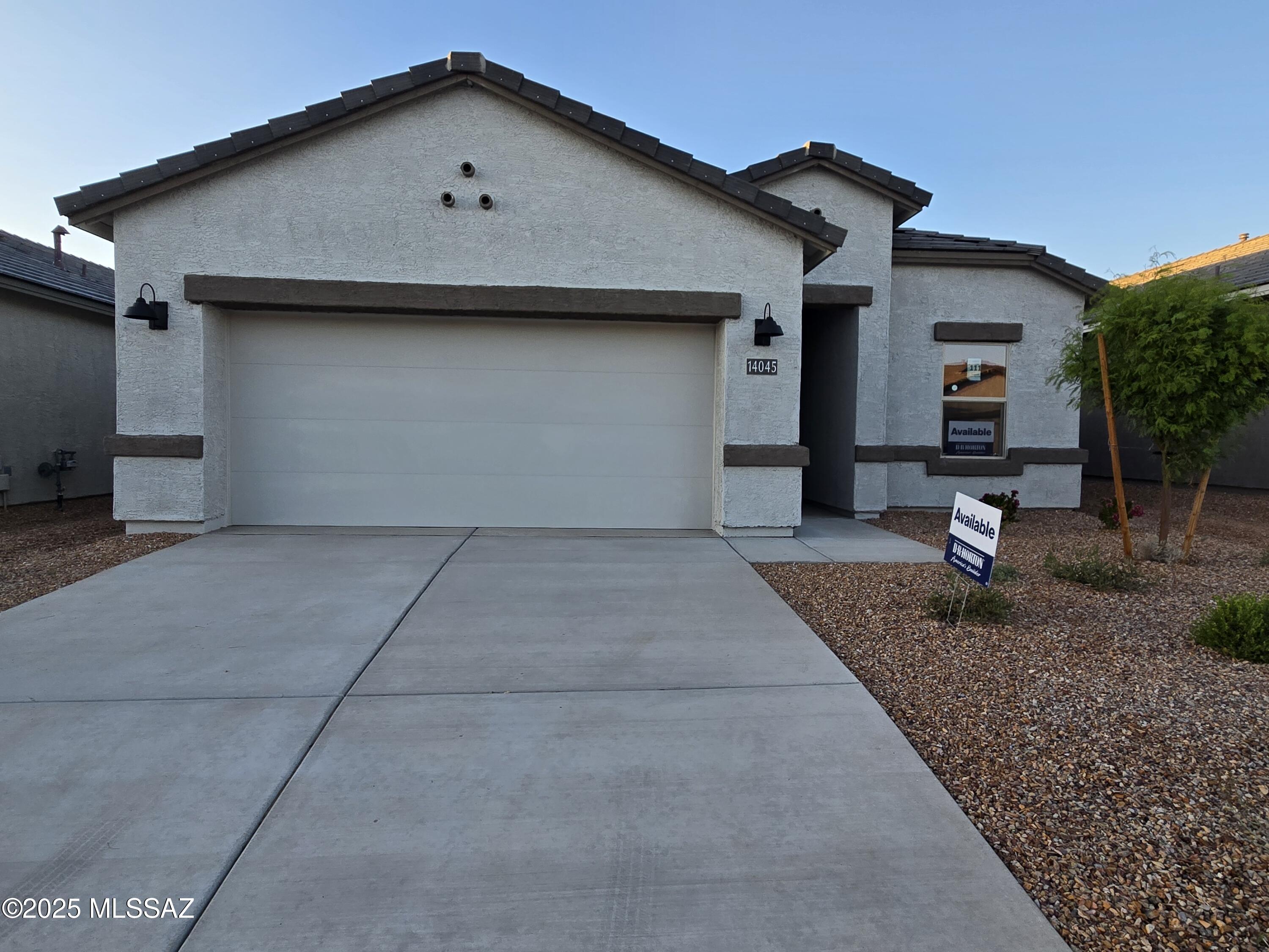 Brand-new construction within Rocking K, a master-planned community. This single-story home boasts an array of sophisticated features that cater to comfort and style. The living area is accentuated by 9 feet high ceilings. Quartz countertops in kitchen and bathroom, shaker style cabinets, wood look tile, plush carpeting in bedrooms plus stainless steel appliances including a microwave, dishwasher and gas range. The primary suite has a large closet for ample storage and a en-suite bathroom with a double vanity. Energy efficiency is at the forefront of this home's design, boasting dual pane low-emissivity windows and ceiling fan prewires to ensure comfort year-round. A 2-car garage provides convenient parking and additional storage space. Don't miss out on this opportunity! Completed.