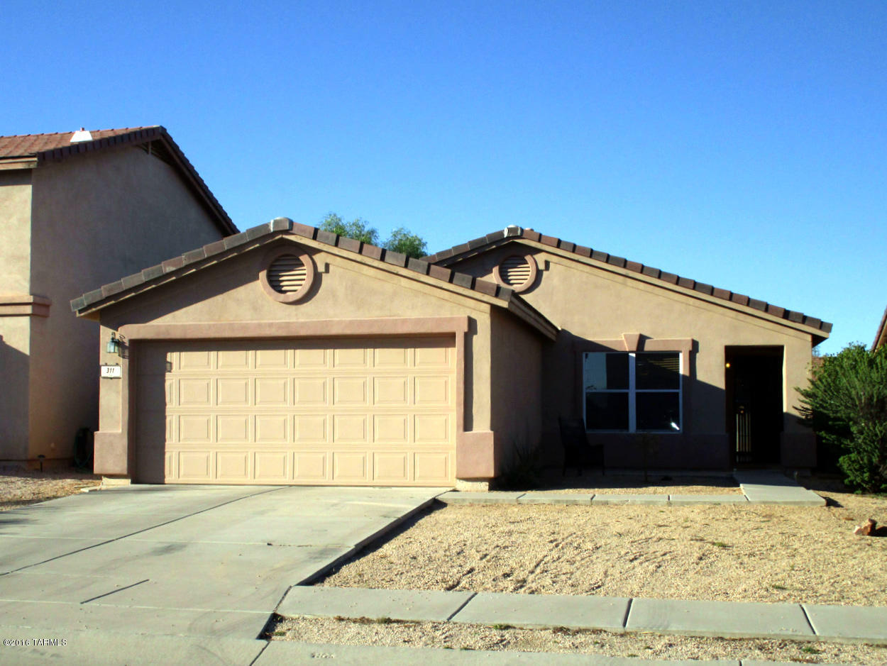 Nice home located in Beautiful Rancho Sahuarita with Fishing Lake, Water Park and Fitness Center. 3 Bedrooms, 2 Baths, and Den with French Doors. Large Open Great Room. Large Kitchen with Lots of Cabinets, Island Bar and Pass-thru to Great Room. Laminate Wood Flooring throughout with Carpet in Bedrooms.