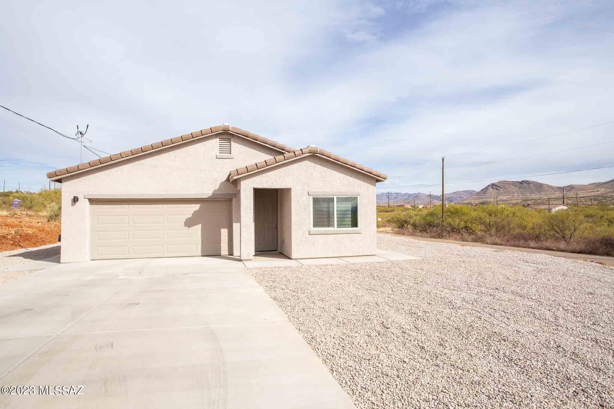 Seller will accept or counter offers between $235,000 and $245,000. Beautiful Brand-NEW Construction Home on corner lot! Ready in mid Dec 2023. With 1250 sq ft of living space, this home has 3 bedrooms, 2 bathrooms, 2 car garage w/220v connection ready for electric car & low maintenance backyard w/large covered patio w/beautiful mountain views & great for entertaining. Spacious kitchen w/plenty of cabinet space, granite counter tops, WATERFALL BREAKFAST BAR, dining area, stainless steel REFRIGERATOR, range, dishwasher & micro hood. Upgraded WINDOW BLINDS. Grey plank TILE FLOORING & baseboard throughout. Primary bathroom w/beautiful walk-in shower surrounds tiled to ceiling, dual sinks, floating cabinet & granite counter tops. Seller contributions towards Buyers closing costs may be avail. Secondary bathroom with tub & shower. NO HOA. This property is eligible for USDA financing w/ZERO down payment/100% financing. Call Agent for more details & come see this home today!