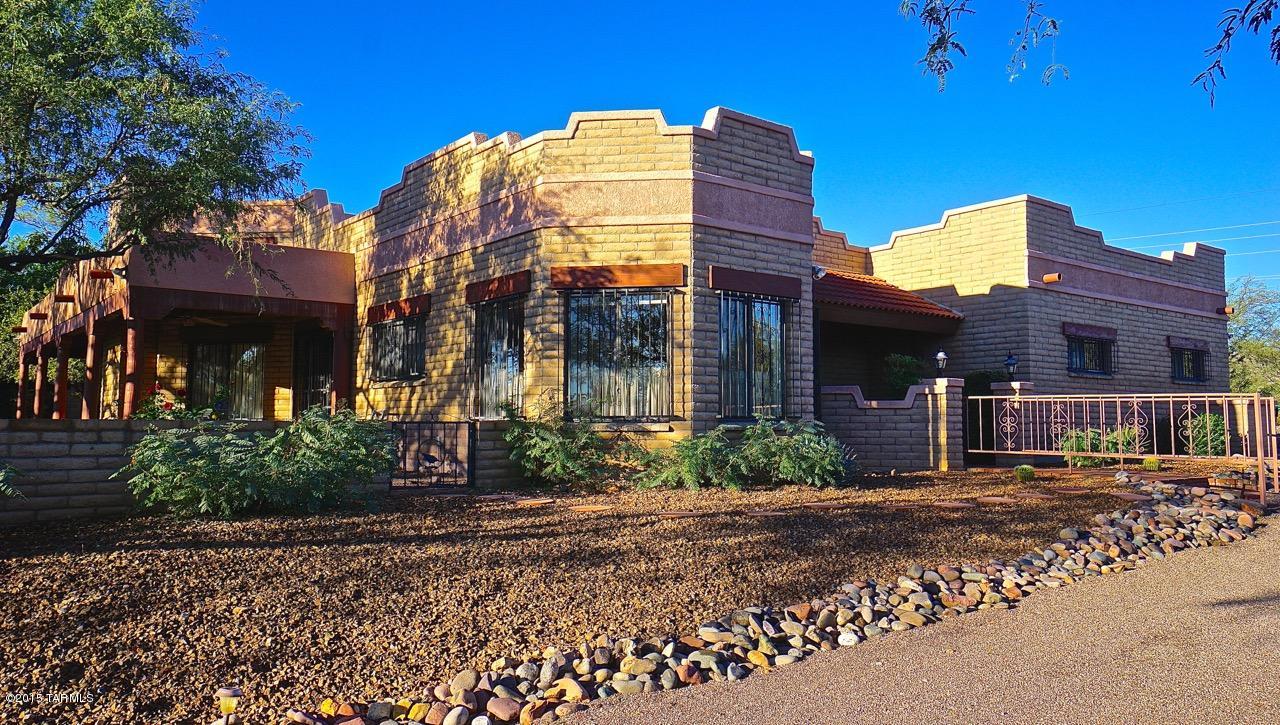 In a town of cookie cutter houses this is anything but. A one–of-a-kind home in a one–of-a-kind neighborhood offers a desert getaway like no other. A 15-foot ceiling accented by timber beams surrounded by clerestory windows flanked by a towering fireplace is your great room, which, for once, is appropriately named. This two-bedroom two + ½ bath home is so much more than what “pen to paper” can do justice to. A few of the amenities include: a den with a beautiful built in office space, a cedar closet off the laundry room, a walking trail through the backyard desert, tree lined patios off the master bed and dining room and a walk-in master closet that could double as your third bedroom, if you’ve run out of room to put your winter guests. This house also includes a rear entry garage, a newer high efficiency air conditioner and mature, well cared for landscaping, set on more than an acre of land in a non-age restricted community.
This is a home that is neither imitated nor equaled waiting for the buyer who wants a residence that offers more than just a place to park a car but one that also moves the soul.