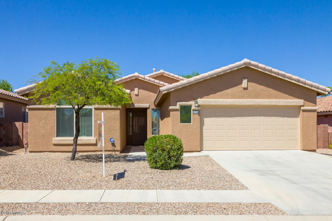 SELLER RELOCATING! Enjoy this beautiful well maintained home on Cul-de-sac in sought after gated community of Rancho Agua Dulce. New Sun Screens (Can be easily removed) 3 bedrm,(split floorplan), spacious master bedrm, New ductless A/C added to master bedrm, 2 1/2 bath, plus den/office. Ceiling fans, new light fixtures, tinted windows throughout. Enjoy this beautiful kitchen w/Corian counters, plenty of cabinets, dining area, great
room with built~in entertainment center. Freshly painted exterior and interior. Oversized garage~side door entry to yard. Move in Ready! Community Pool & Spa~ Close to Freeway, Shopping, Jogging paths, Parks, Hospital, Downtown. and Pima
College. HOA Covers Refuse Collection too! ~Great Place To Call Home~