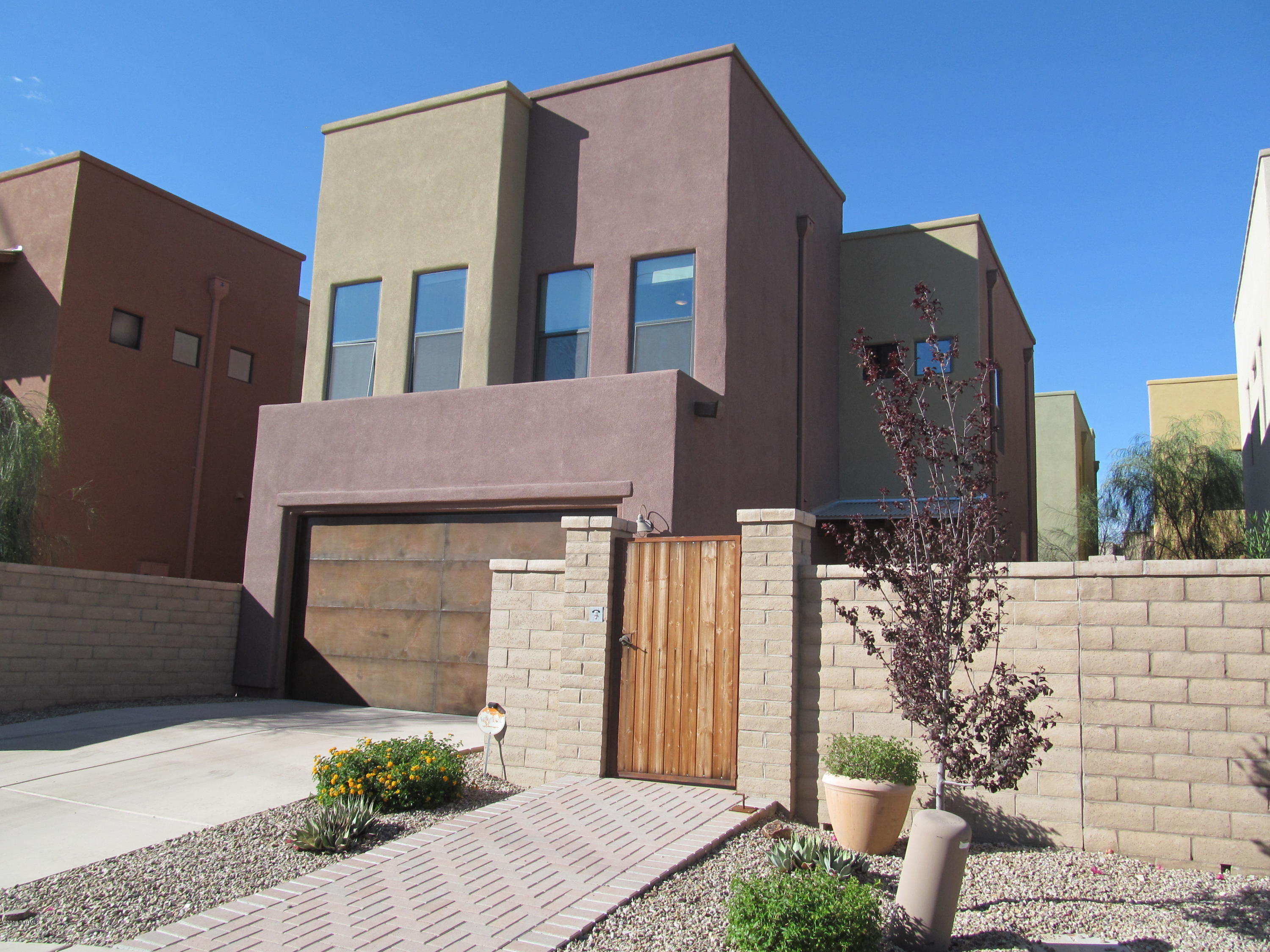 Built 2011-Barrio style 3BR home in gated community overlooks River walk with private gate access just steps away. First floor is open & bright offers contemporary kitchen with GE Cafe SS appls, breakfast bar, large pantry/plenty of cabinet space, dining area, powder room. Upstairs guest BRs over look River walk, laundry room w/h-ups (Dryer h-up electric), large master bedroom with his/her closets, master bath shower & garden tub. TEP Guaranteed, 2 car garage, Water softener system-maintained by tenant. Community pool/spa, park, Dog Park, private access to River walk. Security Deposit $1840. Pets subject to approval**RENTAL RATES REFLECT A $65 CONCESSION IN EXCHANGE FOR TENANT'S AGREEMENT TO CLEAN OR CHANGE HVAC FILTERS MONTHLY. RENTAL RATES ARE $65/MO HIGHER THAN STATED W/O CONCESSION*