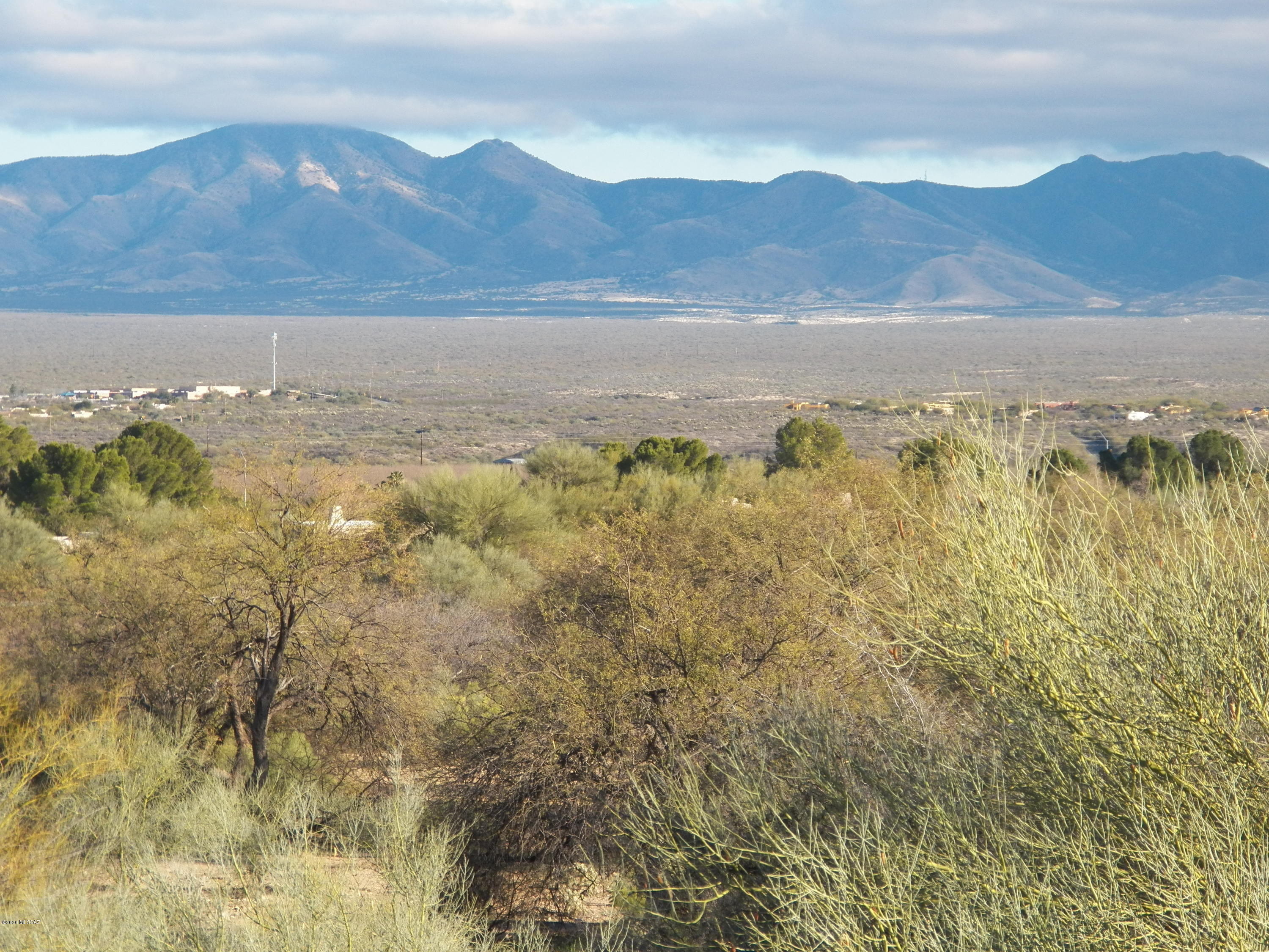 The English translation for ''Pairaiso'' is ''Paradise''. How appropriate! Once you see the breathtaking view you will agree it is ''Paradise'' and you will never want to leave. This beautiful end unit townhome is surrounded by amazing desert vistas, frequent wildlife sightings and absolute tranquility. Pride of ownership is apparent from the restuccoed/painted exterior to the light, clean interior boasting new improvements everywhere. On chilly mornings curl up on the recliner in the great room watching the sunrise over the mountains. The Murphy bed in the guest bedroom offers dual functionality. Choose your level of activity by visiting two nearby Rec Centers, the Continental Shopping Plaza or Do Nothing and Just Relax in ''Paradise''.