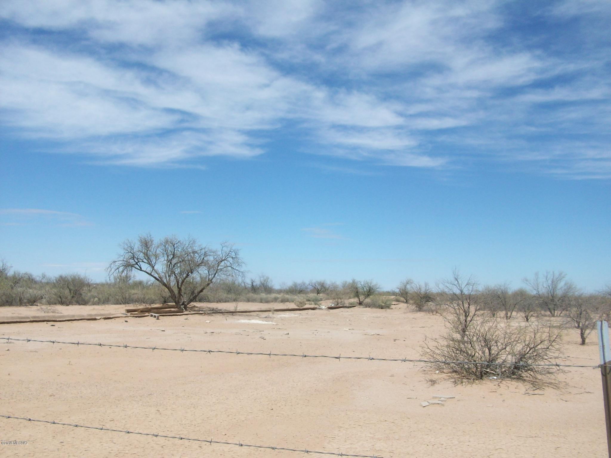 Flat acreage NW of Picture Rocks - bordered on east by City of Tucson land - all fenced.  Property has abandoned mobile - not affixed, seller does not have title.  Great area for a private homestead on 7++ acres
