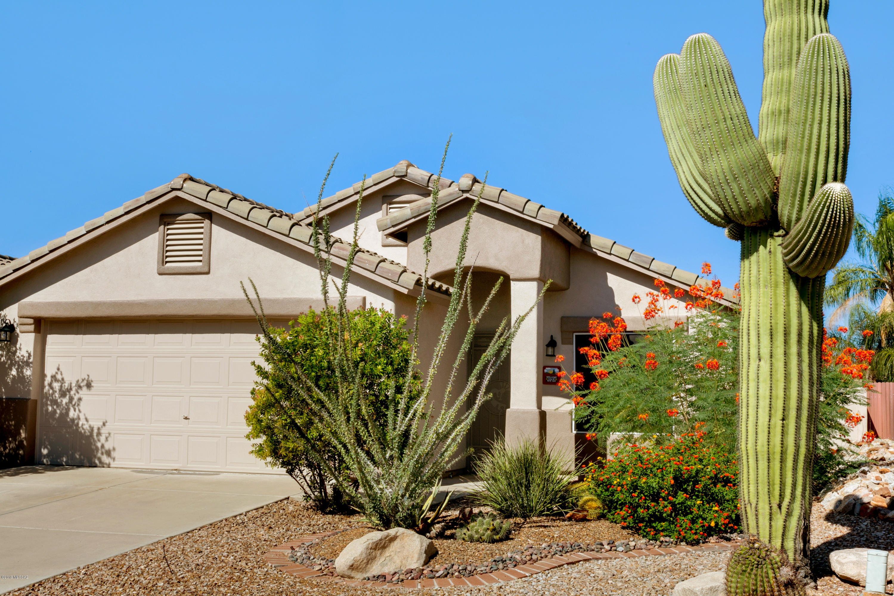 Outstanding former builder's model with all their bells and whistles has been taken to a new updated and remodeled level. Designer upgrades to kitchen include quarts countertops, refinished solid wood cabinetry, stunning back splash and black appliances. Every room and the entire exterior have been painstakingly hand painted with the best products available.  This easy flow floor plan features the master with large bath suite in the rear of the home, note the hand painted mural in the toilet closet. Nice open area between the kitchen and dining/living rooms is comfortable and practical. The front yard undoubtedly the best on the block with well maintained vegetation, the back has been hard and soft-scaped for your upcoming outdoor activities including the raised fire pit patio.