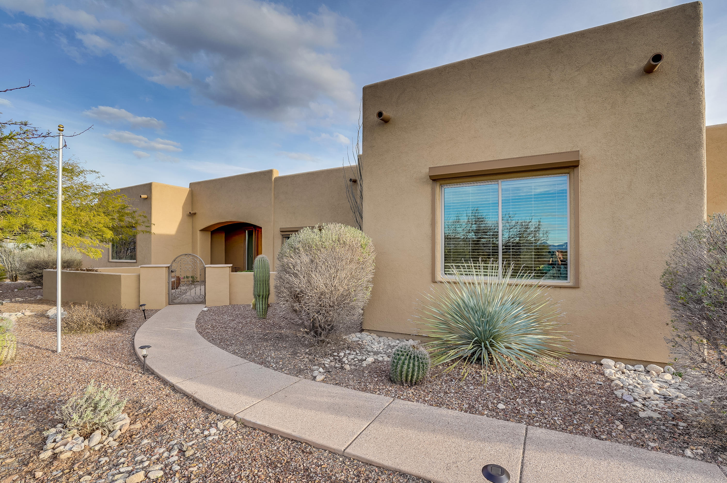 Custom home on almost 2 acres.  Located in scenic Mountain Creek Ranch.  This private lot backs up to state land increasing that private feel.  Beautiful and smart split floor plan.  Master bedroom features private office, private patio, large walk in closet, master bath with custom walk in shower and garden tub, double vanity with granite counters.  Solid oak doors throughout, Large kitchen with 5 burner gas cook top, double oven, large pantry, breakfast bar. Laundry room with plenty of cabinet storage could easily double as hobby room. 3 car garage with extensions, 220V outlet.  
Additional features include rolling shutters,security film on windows putting green ,BBQ, professionally landscaped back yard.