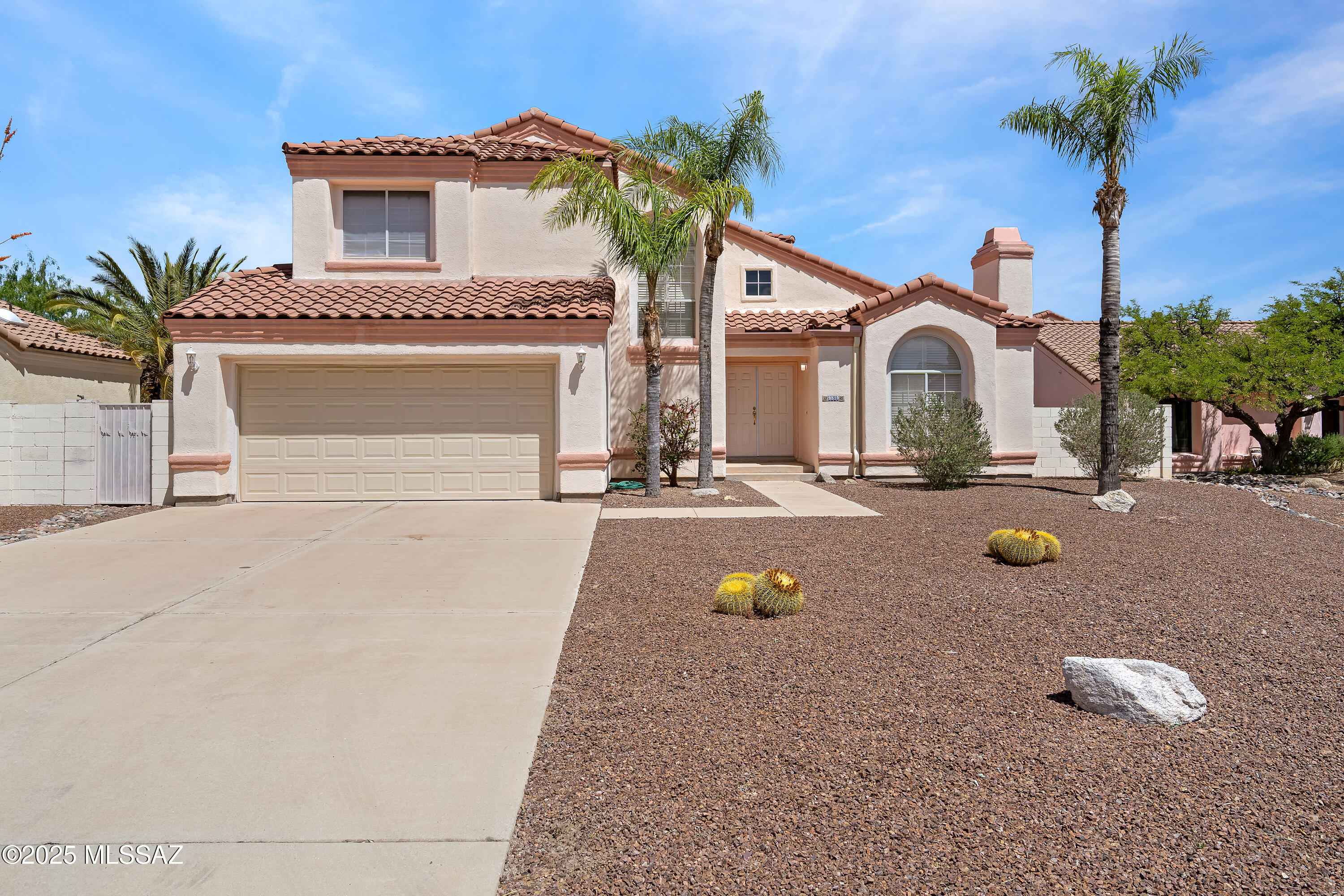 . A rare chance, this 3 bedroom 2.5 bath home boasts one of the largest front lots in North Ranch, with a 4+ car driveway in addition to the 2 car garage-a major advantage in a community where overnight street parking is prohibited. This charming 2,060 sq ft home is filled with natural light, tile countertops, wood and tile flooring, custom wood shutters on every window, and a spacious primary suite with a walk-in shower and a soaking tub. Private east-facing backyard with a covered patio. Newer A/C (2021), water heater (2017), and electric range (2021). The North Ranch community offers two pools, tennis, pickleball, bocce ball, volleyball, walking paths, and a large covered gathering area, all for an ultra low HOA fee. A true gem ready for you to call home.

Welcome to North Ranch. 
This beautiful home is positioned on one of the largest front lots in the community, a rare opportunity for ample space and privacy. In addition to its 2-car garage, this home offers an expansive driveway, comfortably accommodating 4+ vehicles, an invaluable feature in a community where overnight street parking is not permitted. Additionally, the gentle curve of the quiet cul-de-sac allows for daytime parking of even more vehicles without encroaching on your neighbor's property, ensuring convenience for both residents and guests.

Stepping inside you'll discover a home bathed in natural light, thanks to stunning large front windows and numerous windows throughout that ensure sunlight graces every room. In addition, every window throughout the home, including both of the large sliding glass doors granting access to the backyard, come fully equipped with louvered custom interior wood shutters.

The interior showcases the beauty of a vintage design, featuring tile countertops in the kitchen and bathrooms, elegant tile flooring, wood flooring in one of the guest bedrooms, and soft carpeting throughout the home, creating a cozy and inviting atmosphere.

Upstairs, you'll find two full bathrooms, including the spacious primary ensuite bathroom, which boasts a double vanity, a walk-in shower, and a separate soaking tub providing a perfect retreat at the end of the day. The primary bedroom itself offers generous space, ensuring comfort and tranquility. Downstairs, a convenient half bath adds to the home's functionality, making it ideal for both everyday living and entertaining.

Step outside to your private, fully enclosed, east-facing backyard, where a covered patio awaits ideal for outdoor dining, relaxation, or simply soaking up the beautiful Arizona mornings. The backyard offers a serene escape, perfect for enjoying the outdoors in comfort and privacy.

Living in North Ranch means more than just owning a beautiful home it's about embracing a lifestyle enriched by a wealth of community amenities. Residents enjoy access to two sparkling community pools, perfect for cooling off on hot days or enjoying a leisurely swim. For those who enjoy staying active, the community offers both a tennis court and pickleball court, a basketball court, bocce ball, and a sand volleyball court, catering to a variety of interests and activities.

The community also features a spacious, fully covered outdoor gathering and eating area near the main pool, providing an ideal setting for socializing with neighbors or hosting gatherings with family and friends. 

In addition to desert walking trails the community also offers fully marked and wide paved biking/walking paths along both sides of Cactus Canyon Pass, which runs through the very center of North Ranch, allowing residents to enjoy the natural beauty of the area while staying active. These paths connect seamlessly to both the Shannon Road and Thornydale Road entrances, enhancing the convenience and accessibility of the community.

This home has a newer air conditioner, installed in May 2021, keeping the home cool during the warm Arizona summers. The water heater was replaced in December 2017, and the electric freestanding range was installed in June 2021, adding to the home's conveniences.

This home offers a unique opportunity to experience the perfect blend of comfort, charm, and community. With its spacious layout, vintage details with a few appliance updates, and an exceptional location just minutes in walking distance to the amenities within North Ranch, it's ready to welcome you to a lifestyle of enjoyment. 

Don't miss the chance to make this inviting residence your own and become part of a vibrant and welcoming community.