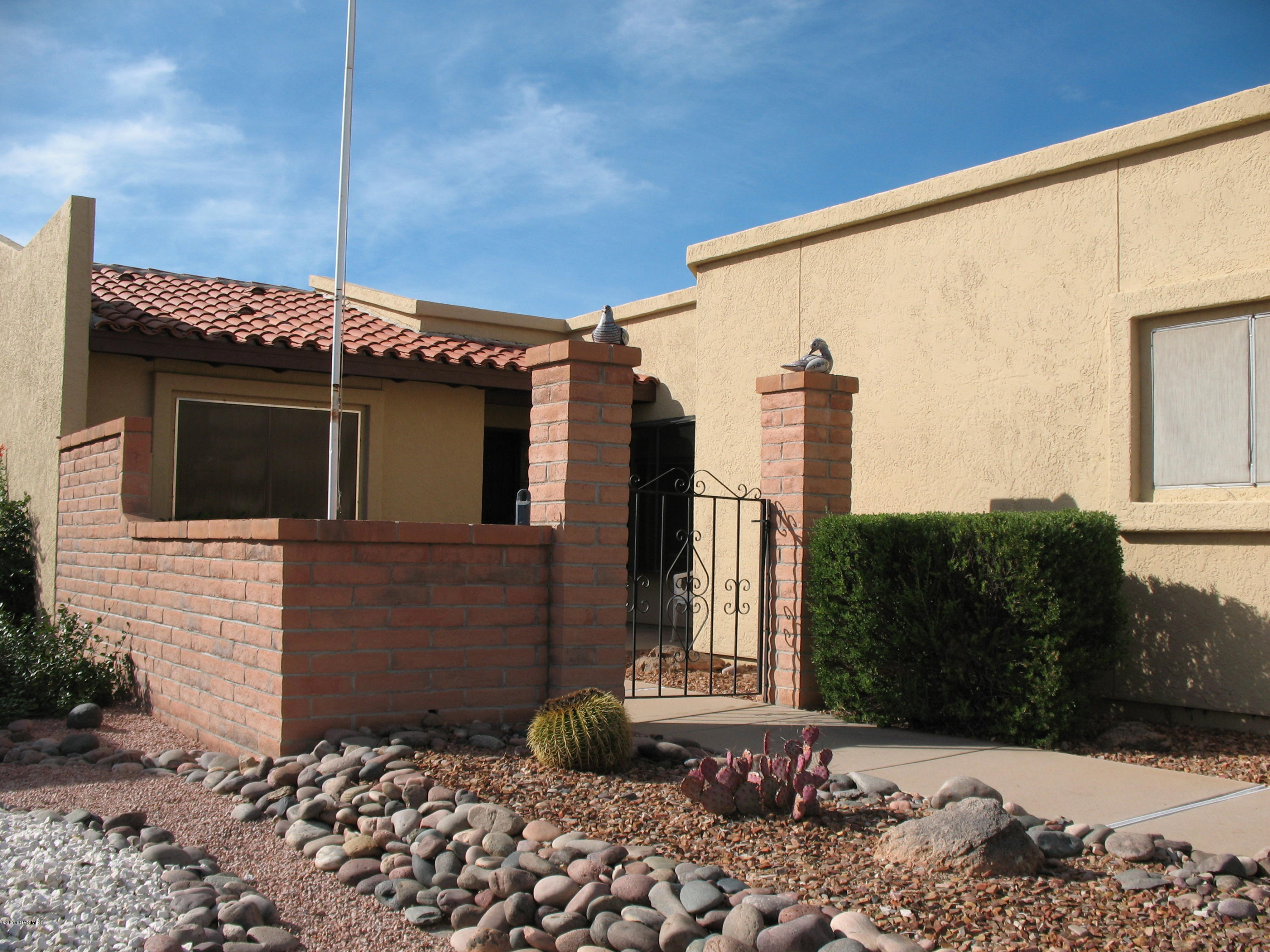 Enjoy active adult living in Green Valley! This well maintained townhome is offered fully furnished & move in ready. Located close to several recreation centers - offering a variety of activities - swimming, tennis, pool, ceramics, lapidary, bocce ball... Play golf nearby at San Ignacio or Canoa Ranch courses... or one of the many other courses in Southern AZ. Spacious main living area, split bedrooms plus small office off of Master Bedroom. Bricked patio faces south with Santa Rita Mountain views and open natural spaces. Home Warranty offered to new owners. One occupant must be 55+ Call to see this one today!