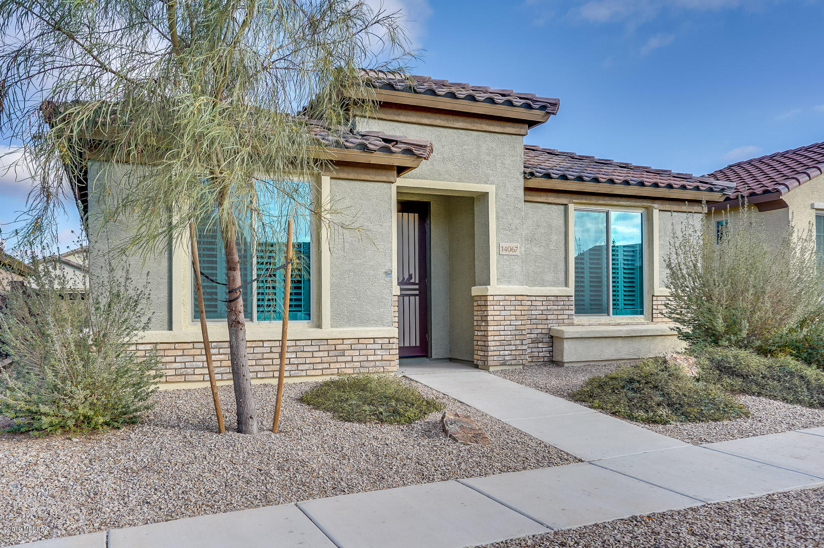Why wait to enjoy the good life. 55+ adult community with all the amenities you only dreamed of when your retired or were spending the winter in the warm, sunny Arizona desert. Move right into this vacant single story built in 2016 and better than new. 2 bedroom split floor plan plus den and 2 full baths. 2 car garage and gated community as well. Granite counter tops, shutters, crown molding and decorator 2-tone paint to mention just a few of the upgrades. Clubhouse, pool, tennis exercise room, putting green and lots of chances to meet new friends. Don't wait on this one. Pulte doesn't build this Spirit model anymore and the 1576 square foot is just  the right size. Priced to sell and quick closing possible.