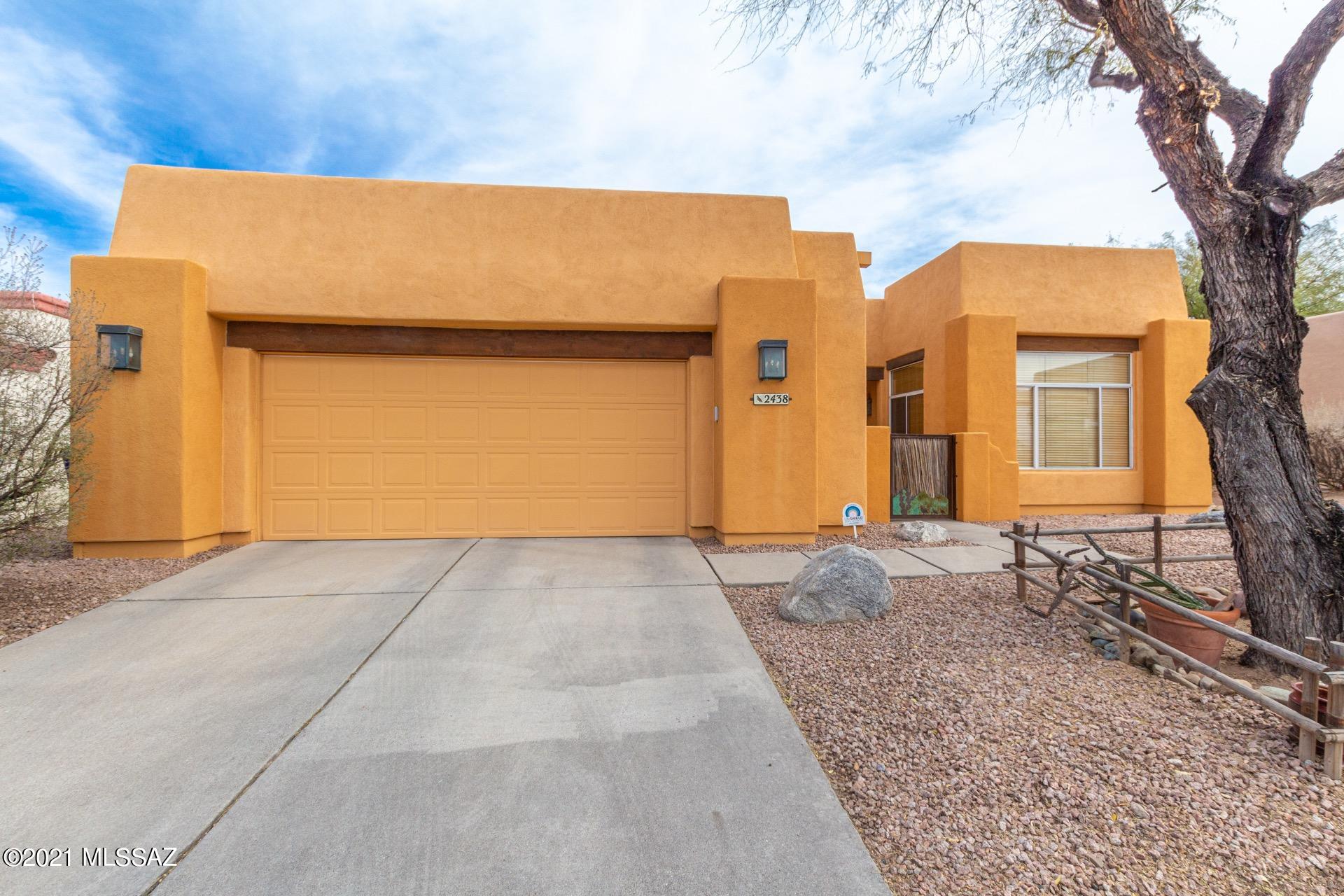 Outstanding Southwestern Home w/a charming gated courtyard entry. Saltillo tile, wood beamed ceilings, corner fireplace in dining area, window blinds, ceiling fans, & custom palette. Tall ceilings, art niches, & French door to patio. Center kitchen island, granite/tile counters breakfast bar, SS appliances, & handsome wood cabinets w/hardware. Perfect home for entertaining inside & out. Gorgeous hardwood floors in all bedrooms, ample closets, & 2 baths w/tile counters. Master retreat boasts patio access, private en suite w/dual sinks, & walk-in closet.. Interior laundry room. An entertainers dream backyard w/a covered flagstone patio, sparking fenced pool, built-in BBQ, SPA hook-up & private covered patio off the master bedroom. This incredible home has it all!