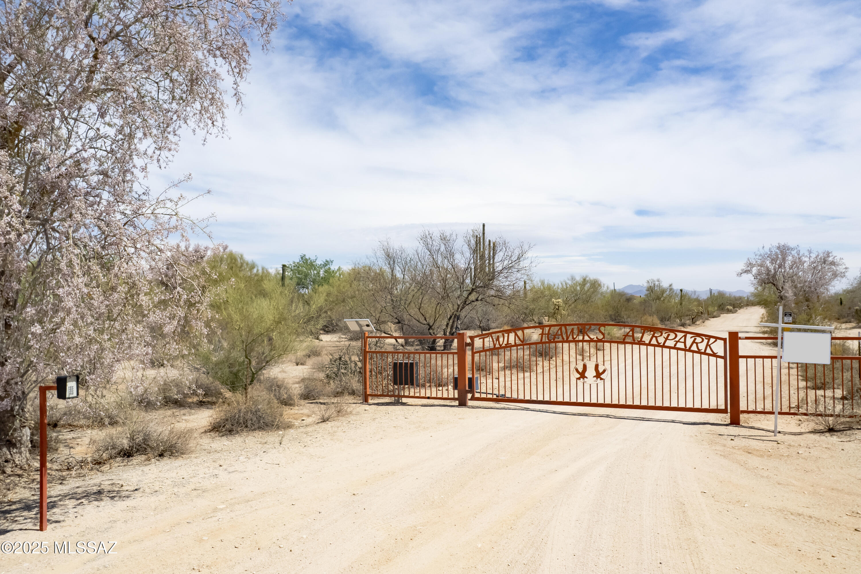 Beautiful 5.33 Acre lot in private, gated Twin Hawks Air Park. The site enjoys
panoramic views of multiple mountain ranges in the world famous Tucson Sonoran Desert. Build your dream custom home and hanger. Perfect homesite for any flying enthusiast. Close to the ever growing town of Marana with top rated schools, medical and veterinary
care, shopping, dining and much more. Easy access to Interstate 10, making travel to Phoenix and other destinations a breeze.