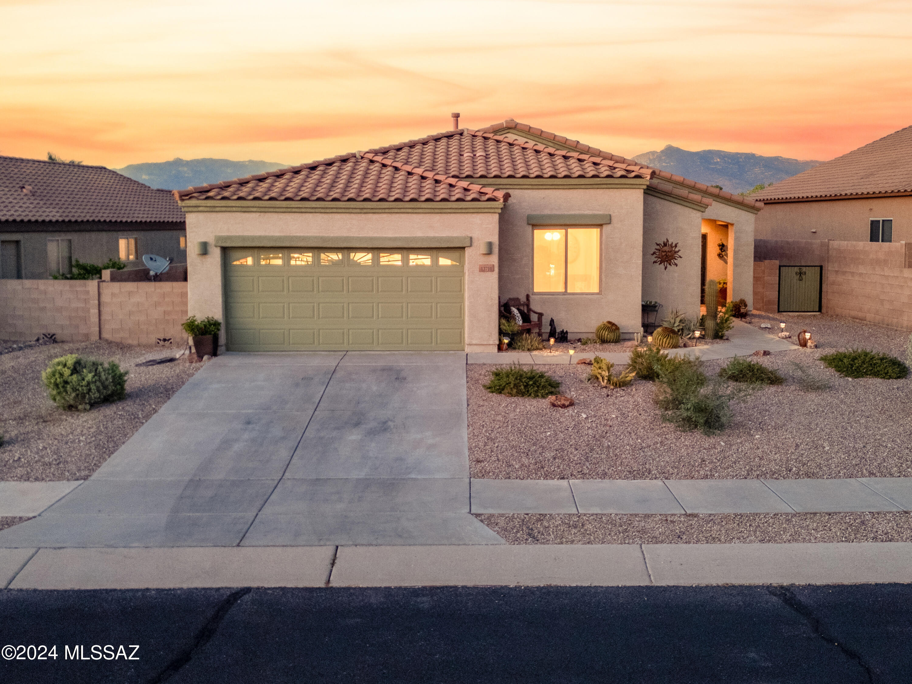 This home is nestled in the prestigious gated Vista Del Lago Community! This exceptional property is situated on a premium lot to capture the expansive views of the Rincon Mountain range and the Rancho Del Lago golf course lake. 
You'll love the refreshing pool and the relaxing spa. Take in the beautiful blue skies by day and the twinkling stars at night. This backyard is ideal for year round entertainment featuring a spacious covered patio and fully landscaped yard. 
Step inside this beautiful residence that has recently been transformed into a meticulously fully remodeled home with attention to detail. 
Expansive great room seamlessly blends elegance with functionality. A versatile space awaits, perfect for entertaining guests or family living. The well-designed split bedroom with 4 spacious bedrooms.
Remodeled kitchen boasts a gorgeous expansive quartz island, newer stainless steel appliances, new water filtration system, quality cabinetry, and stylish unique backsplash to add to the appeal of this gourmet kitchen. 
Retreat to the lavish primary suite, complete with a French door leading to the backyard oasis. Primary bedroom also features new vinyl plank flooring, his & hers closets, fully remodeled bathroom ensuite offers a fully tiled shower, a separate soaking tub and a new vanity with attractive solid surface counters. 
Additional features and upgrades include wood floors, recent fixtures and lighting, water softener system and newer pool equipment.
Brand new air conditioning unit was installed in July of 2024!!! Come see this exceptional property!