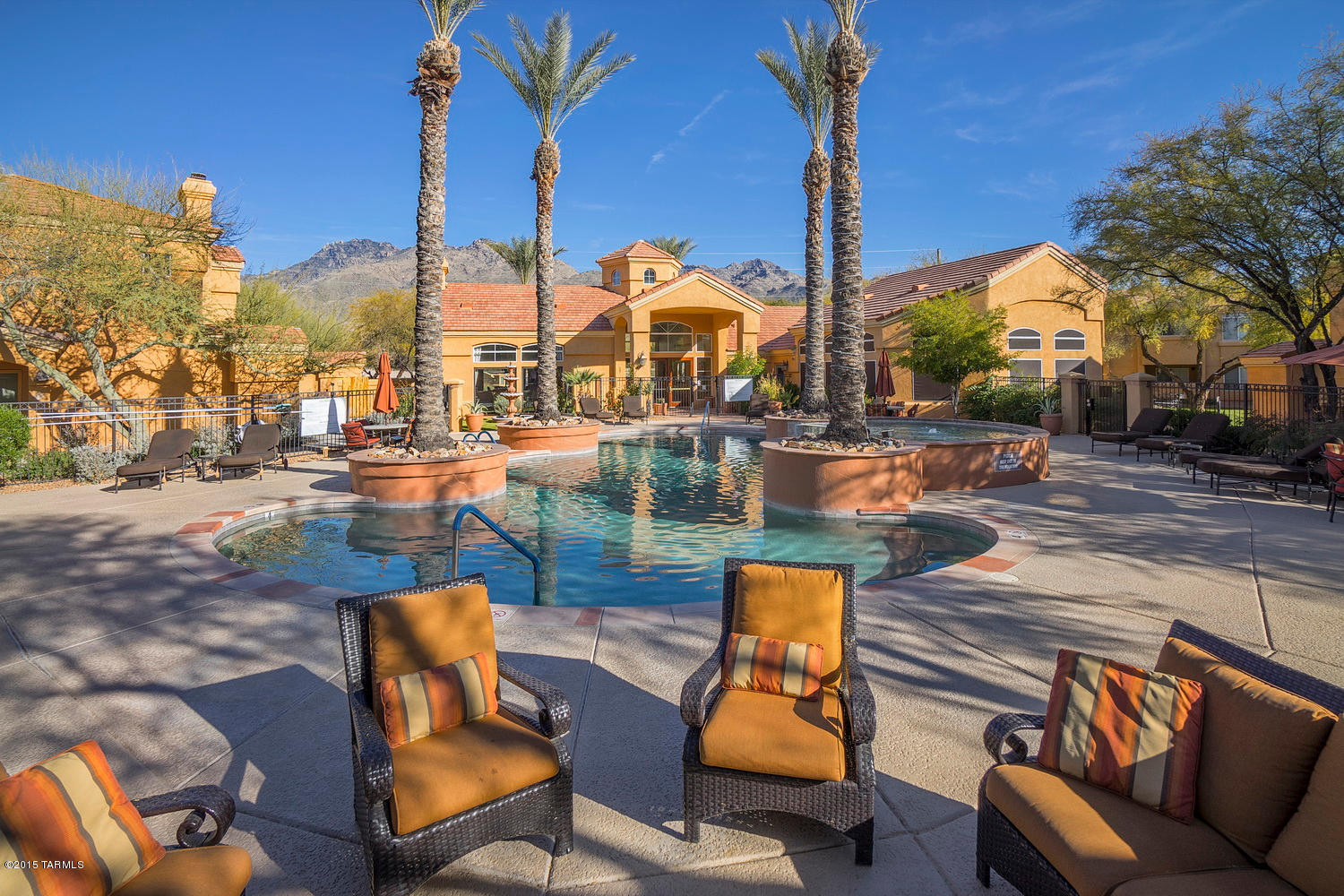 Spacious 2nd floor condo and garage (#75) in the gated Catalina Foothills community of Pinnacle Canyon.  This 2BR/2BA condo features an open floor plan, high ceiling with crown molding, romantic fireplace, split bedrooms, open eat-in kitchen with white appliances and tile counters, washer/dryer included in condo and a convenient location across the street from shopping & numerous restaurants.  The Pinnacle Canyon Condos resort style amenities include a heated pool & spa, exercise facility, clubhouse, bbq areas and park-like grounds. One of only a handful of condos that come with both a covered space (#44) and a 1 car garage (#75).