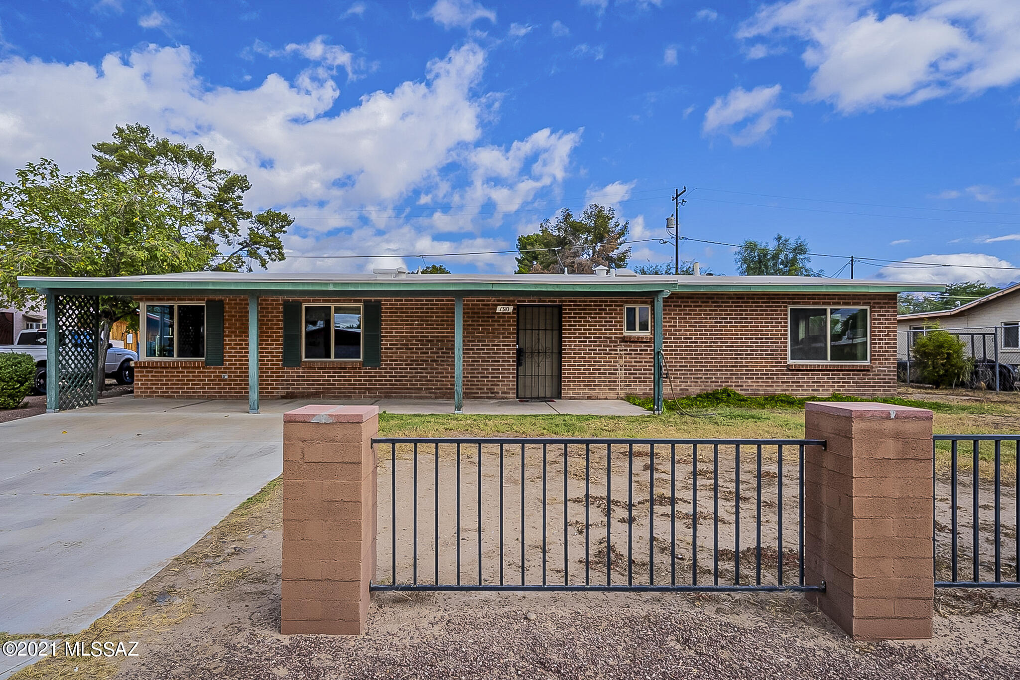 Mid-Century brick mason home located in a well established flowing wells community. LARGE backyard with detached 2 car garage/workshop. Large living area with added addition to be used as either an office or bedroom. Large extended driveway that provides plenty of parking. 2 year old HVAC unit, recent roof replacement, piping replumbed, and master bathroom recently remodeled. No HOA! Close proximity to a city park and elementary school.