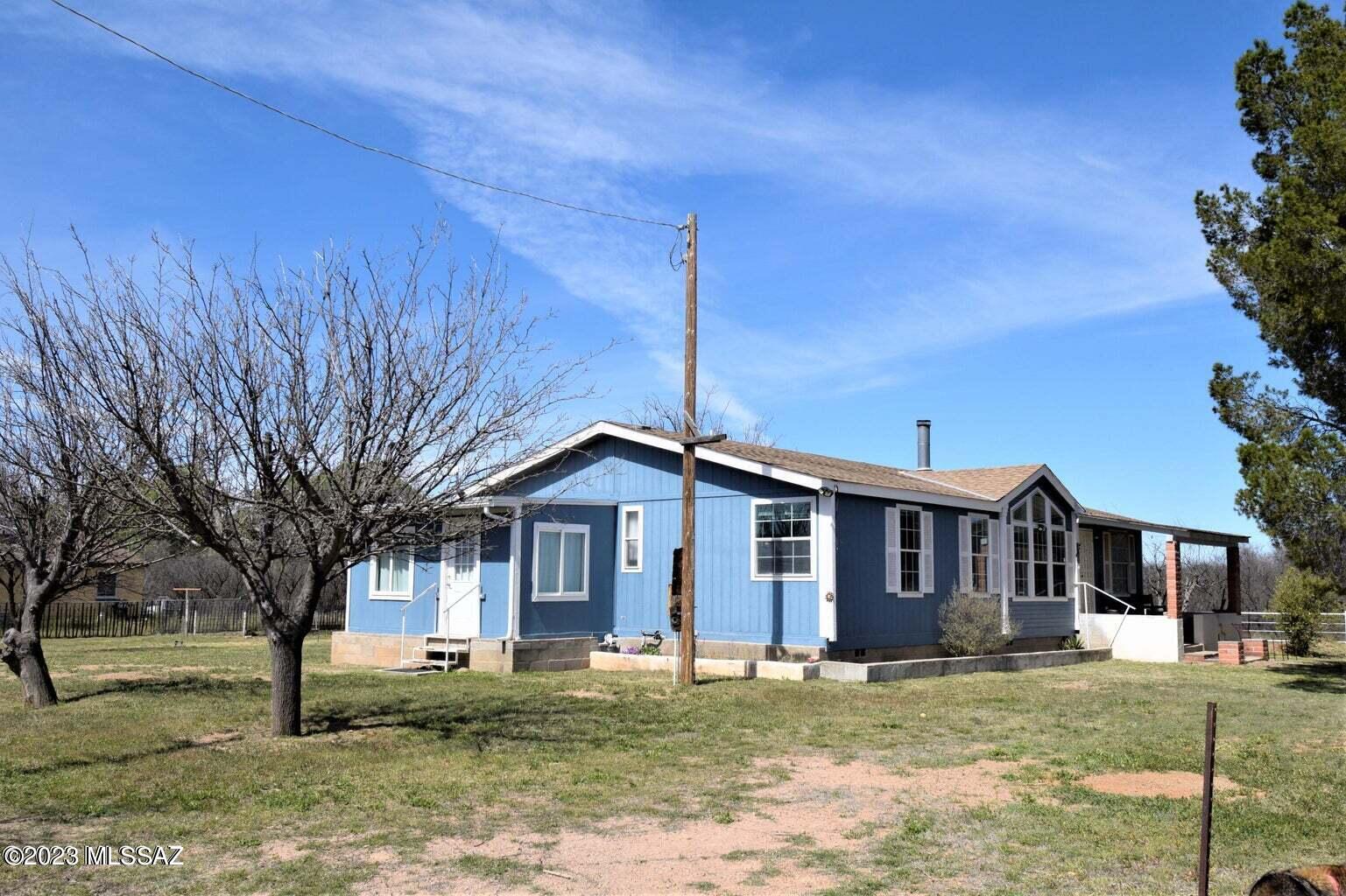 Rare opportunity to own nearly an acre of Historic Arivaca! Beautifully kept 3 bedroom, 2 bath 2004 built modular home. NEW Roof installed in 2022. Separate shed/storage area. The home boasts a large fenced yard for your animals if wanted. Property has a sloping pasture area to the west of home, included in the acreage. Recently replaced HVAC System features a propane furnace. True Split floorplan and walk in closets in guest rooms! Just a short walk to historic Arivaca townsite, library, general store/Gas Station and Buenos Aries National Wildlife Refuge for birding and hikes! Take a look today!