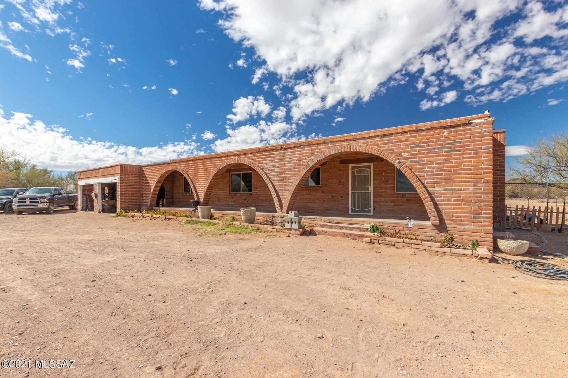 Trying to escape the loud city? Then this home is perfect for you! Not only is this house sitting on 10.4 GR-1 zoned acres, but the property is also surrounded by natural desert, beautiful mountain views in every direction, and the interior of the home has been completely remodeled. Plus, the whole front yard is rigged with a full irrigation system to water the many fruit trees and palms. The property will also include the livestock present on the property if you choose (Ducks, 2 goats, a pair of turkeys, and lots of hens/roasters). Come view this rare desert gem for yourself today!