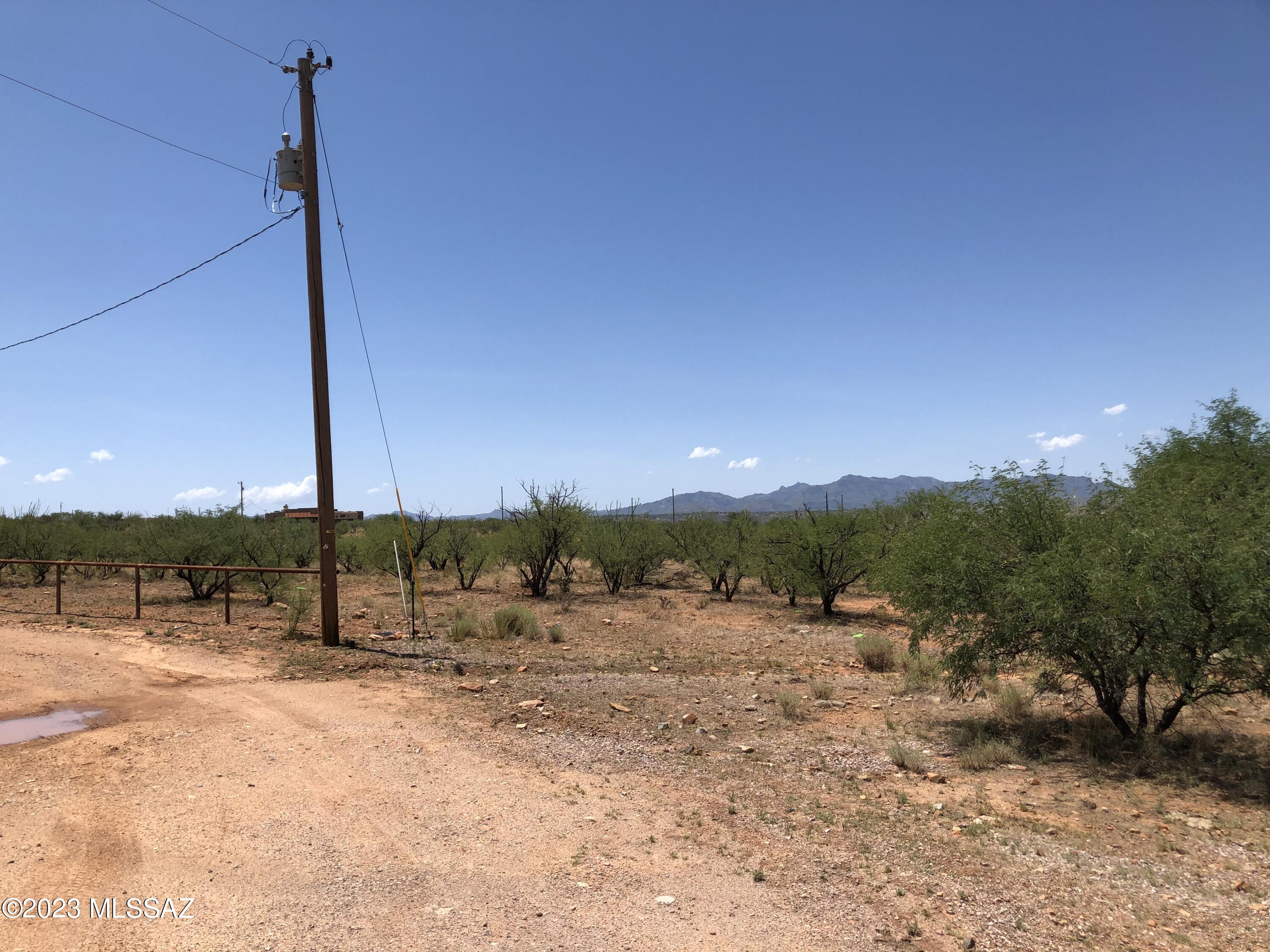 Nice building lot that is flat and easy to build on.  Paved access and mountain views all around.