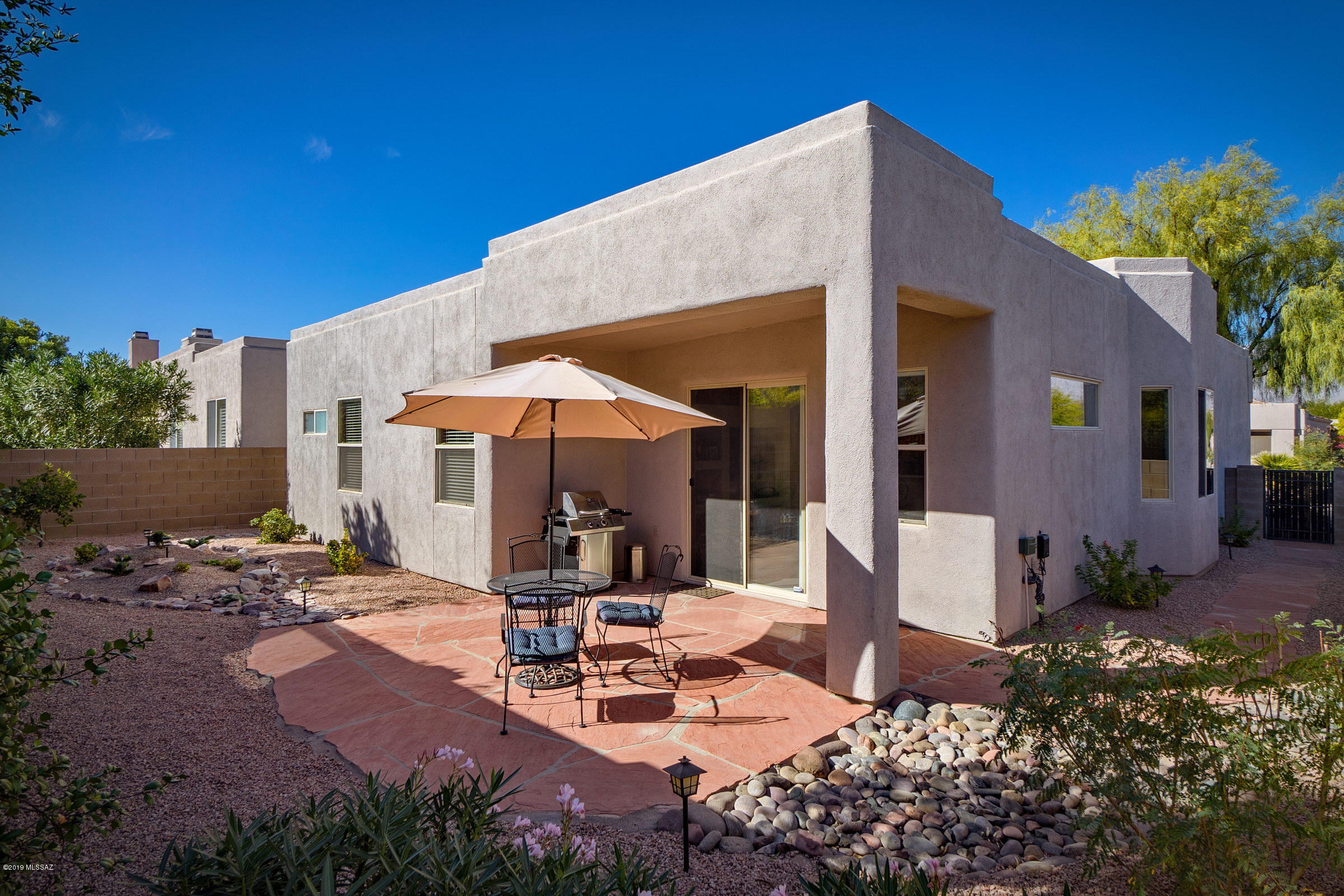 Gated Northeast Foothills at Sabino Canyon & Tanque Verde by AF Sterling.  Sitting on a large corner lot with gorgeous mountain views & a spacious common area just across the street.  Large picture windows & skylights allow loads of light to flood the home.  Comfortable floor plan includes living/dining great room, a kitchen w/bay window breakfast area & newer stainless appliances, & family room off kitchen. A large master suite.  Split Bedroom Floor Plan.  Water Softener.  Custom designer interior paint.  N/S Orientation. Expansive Flagstone patio. Gently lived in HOA includes 3 pools/spas, front yard maintenance, roving security.  Close to Udall Park, Sabino Canyon, resorts, Tucson Country club, shops, restaurants, bus.  Just right - as seasonal or permanent residence.