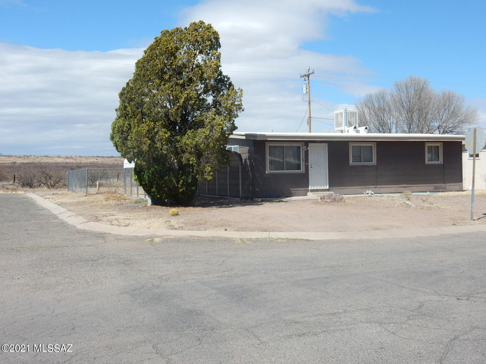 Great location  Corner Lot with open space  behind house.  No neighbors on 3 sides!!   Nice 1223 Sq ft home  3bdrm/1.5 bath/1 carport.   Large addition family room with Beehive fireplace adjacent to half bath/laundry room.  Open Kitchen plan and dining area 
Large back yard chainlinked with large storage shed.