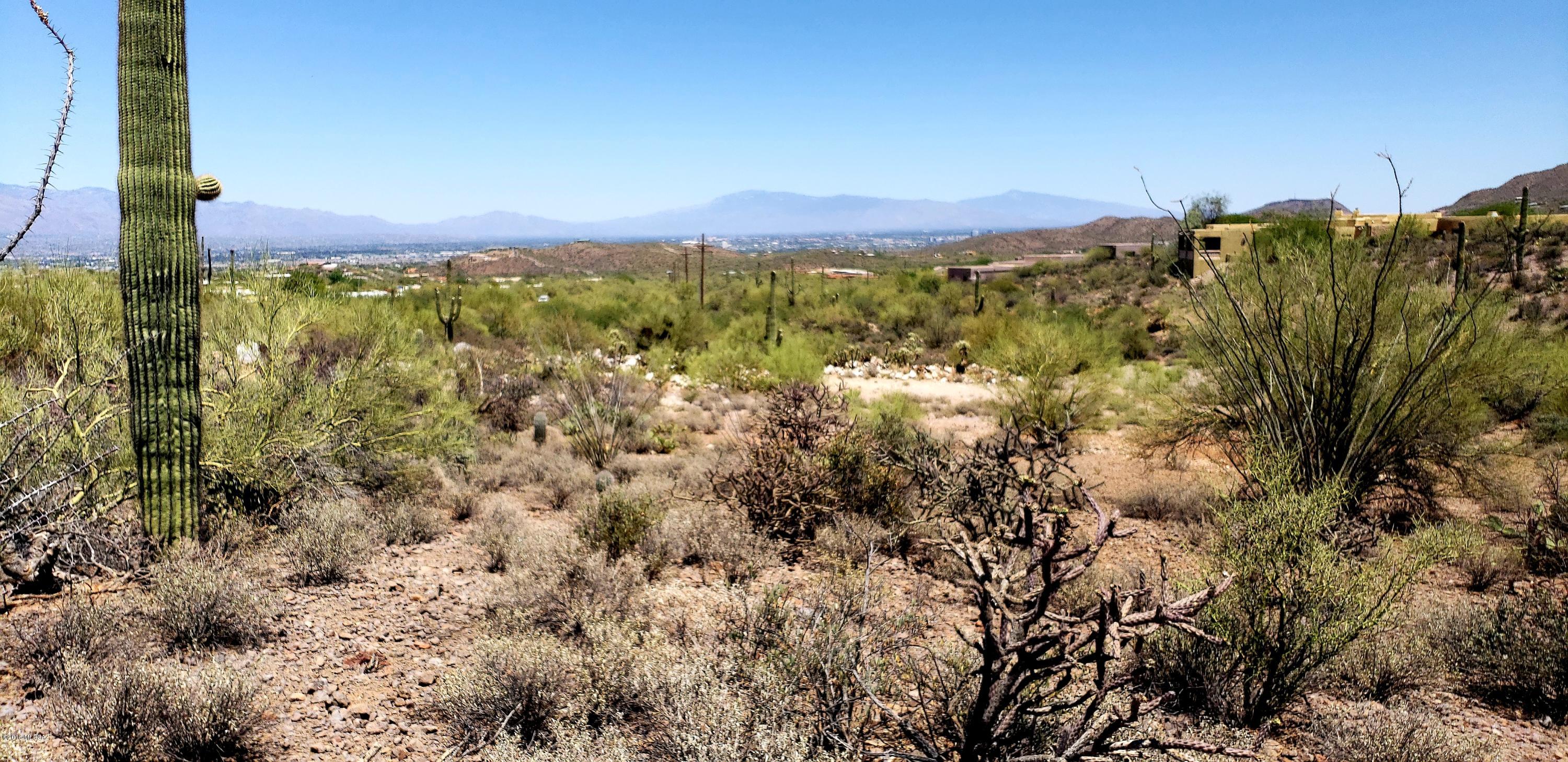 PRIVATE 3.3 acre parcel with a high sighted building area located at the west end. Plenty of Saguaros as well as a wash/wildlife corridor located along the south property line. 360 degree views all the way to downtown Tucson. Great mountain views as well. All utilities to the lot line. Just add septic. There is a large, flat area onsite as well for any out buildings.