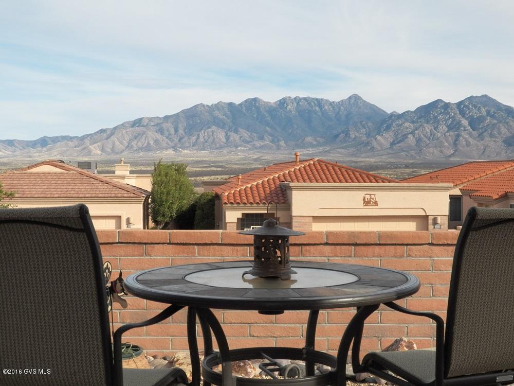 The Southwestern decor and accents are very attractive and appealing as you enter this home. But your full attention immediately shifts to the spectacular mountain views seen from the wall of windows in the living room, kitchen and breakfast area. Prepping in the kitchen is quite enjoyable with such amazing views. Easy access from kitchen to the patio for BBQ or entertaining in a private setting. Well designed floorplan consisting of 2BR, den, 2.5BA plus oversized 2-car garage with storage cabinets and workbench. Newer tile flooring in all traffic areas. Berber carpet in BRs and den. New HVAC unit installed 2011. Exterior painted in 2014.