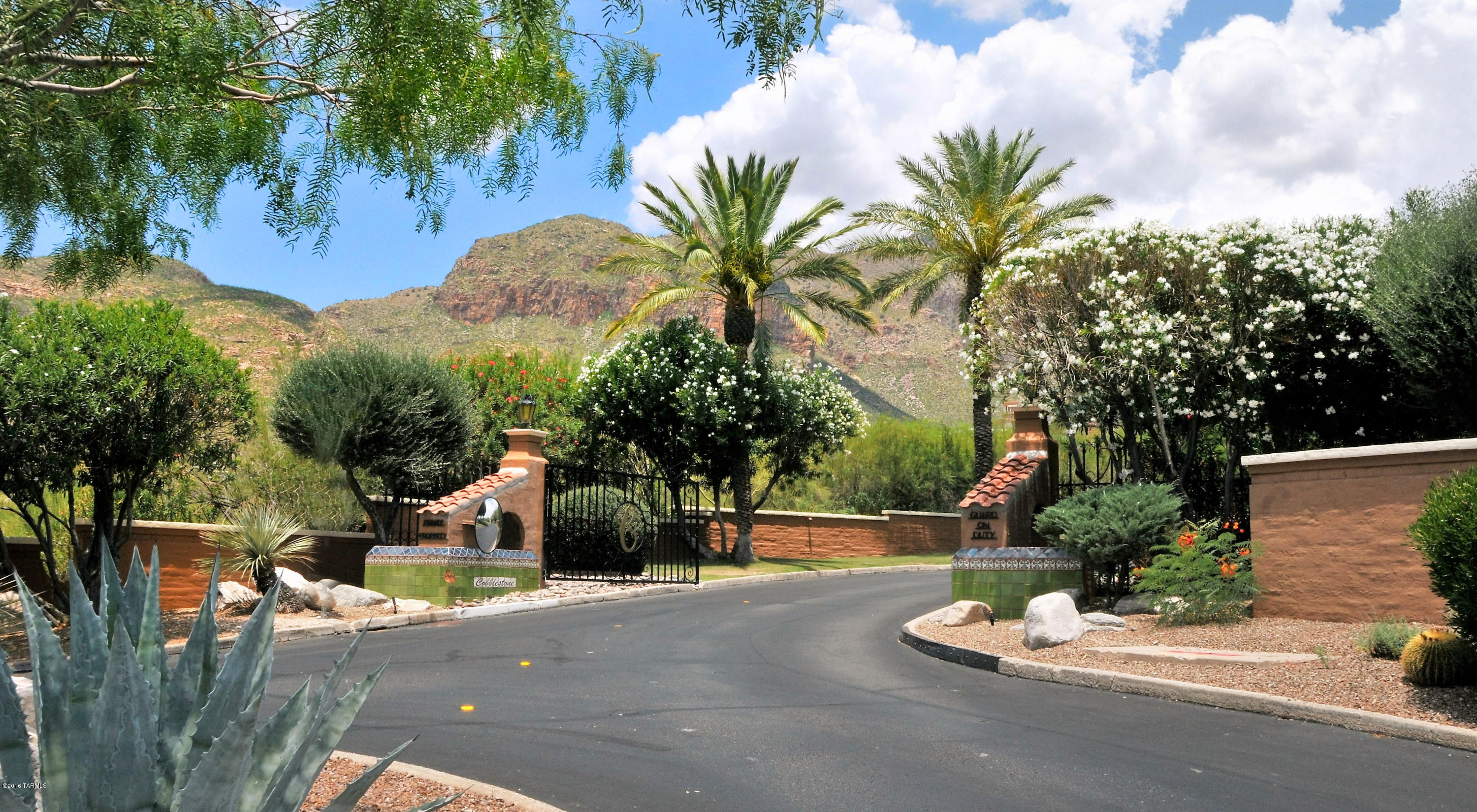 Prestigious Gated Cobblestone Community in the Catalina Foothills! Offering a .84 acre lot situated on a cul-de-sac street boasting 360 degree Mountain, City & Sunset views! This lot is ready to be built on with all utilities at the lot. The lot sits up high allowing for amazing city and mountain views, surrounded by lush green natural desert! This elegant community is established in one of the best locations in the Catalina Foothills. Tucked away in a private setting yet minutes away from incredible dining, shops and the La Encantada Mall.  Exclusive builder is Cornerstone Homes please call regarding package details. Cornerstone Homes is an Exquisite Custom Home Builder dedicated to quality & craftsmanship. Multiple floor plans, elevations, pool, landscape & other packages to choose from.