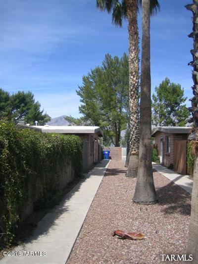 Terrific Adobe 4plex located directly across from Ft. Lowell Park.  Completely renovated in 2005 with updated electrical, roof, flooring, and appliances.  Instant cash flow with existing tenants in place.  Two- 3 bed/2 bath units and Two- 2 bed/1 bath units, all have private fenced yards, A/C, covered parking in rear.  Great location next to Park, Tucson Medical Center, Shopping, and Amenities. Always leased.
