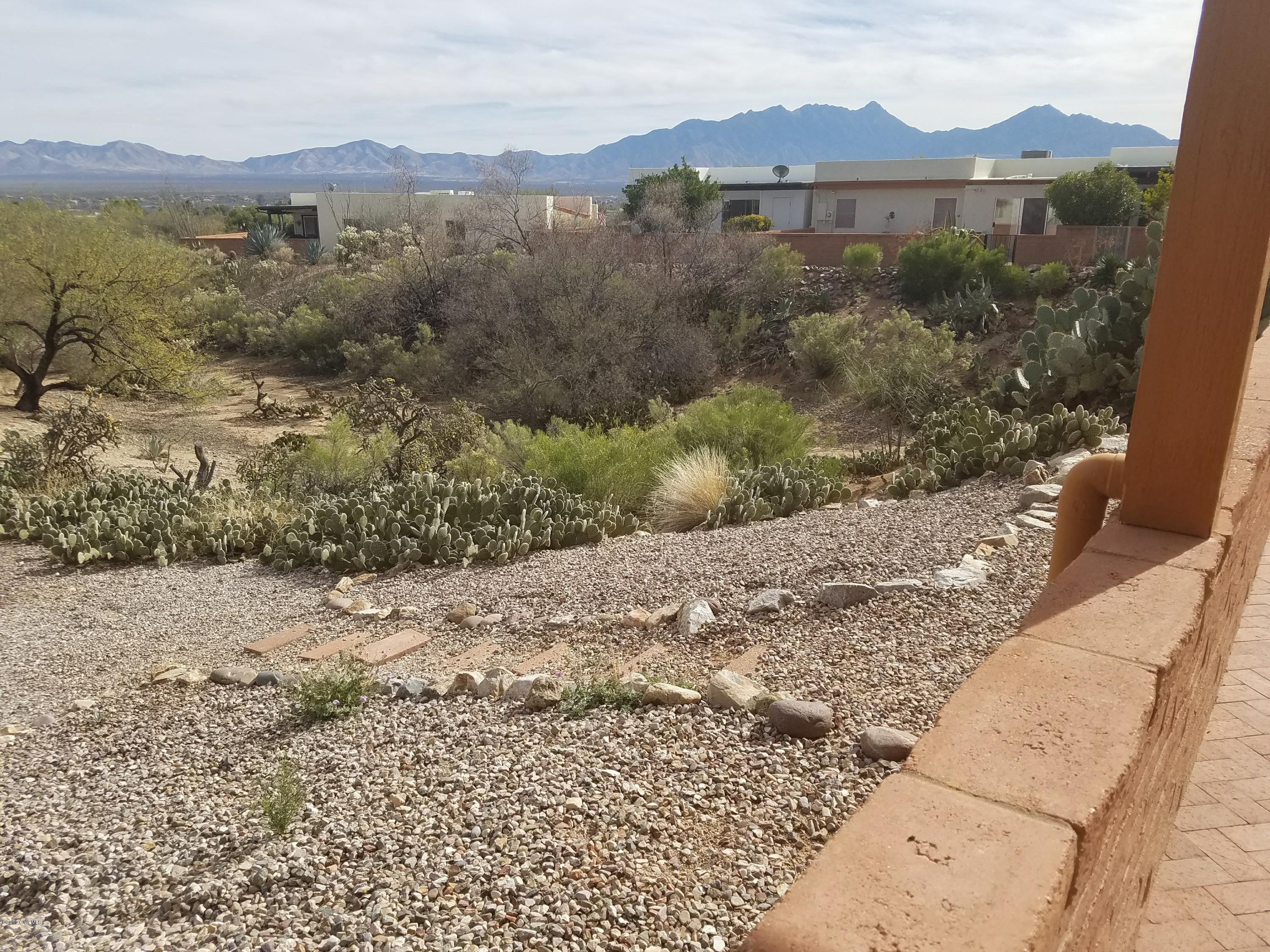 VIEW,VIEW if your looking for a view in great close central neighborhood & close to GVR Continental Vistas pool, you have got to see this updated end unit on an arroyo with lots of light.
 kitchen has granite, and soft close doors, tile w/ carpet in Mbdrm, private front courtyard, back patio walled, you can enjoy views and wildlife in the arroyo.