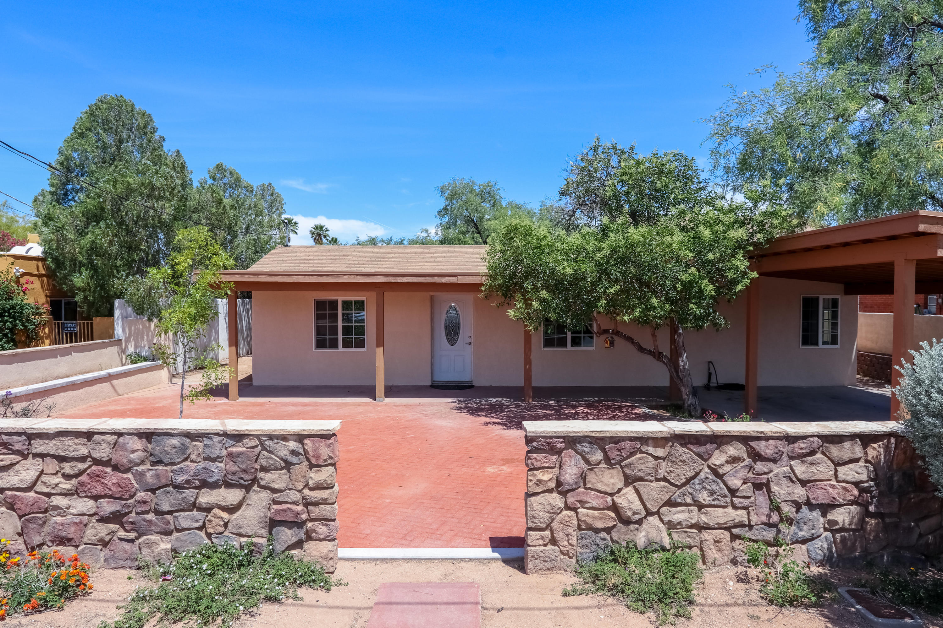 Midtown Gem! This beautifully renovated 4 bedroom 2 full bath has it all. As you pass through the inviting Courtyard you enter the house and notice the Formal Dining Room, Living Room, Family Room, spacious updated kitchen with great natural light, Resort like Master bedroom/bath with recessed mood lighting, walk in shower and jetted tub, one of the remaining spacious 3 bedrooms features a built in loft which the kiddos are sure to enjoy,  Huge backyard features covered carport and workshop, gorgeous mesquite trees provide amazing shade, complete aquaponics system to grow your own veggies, chicken coop, close to shopping, dining, schools, work, ! What else could you ask for!!