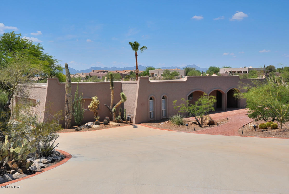 Large 2819 sq ft home in Cat. #7. Beautiful mountain views from the front and city lights from the back yard. Living room with family room off the kitchen. Formal dining room. Split master bedroom. Wet bar in family room. All ceramic and wood flooring. Huge Arizona room. This home is on a cul-de-sac lot and borders natural desert area - very private! Covered patio that overlooks the pool and hot tub.