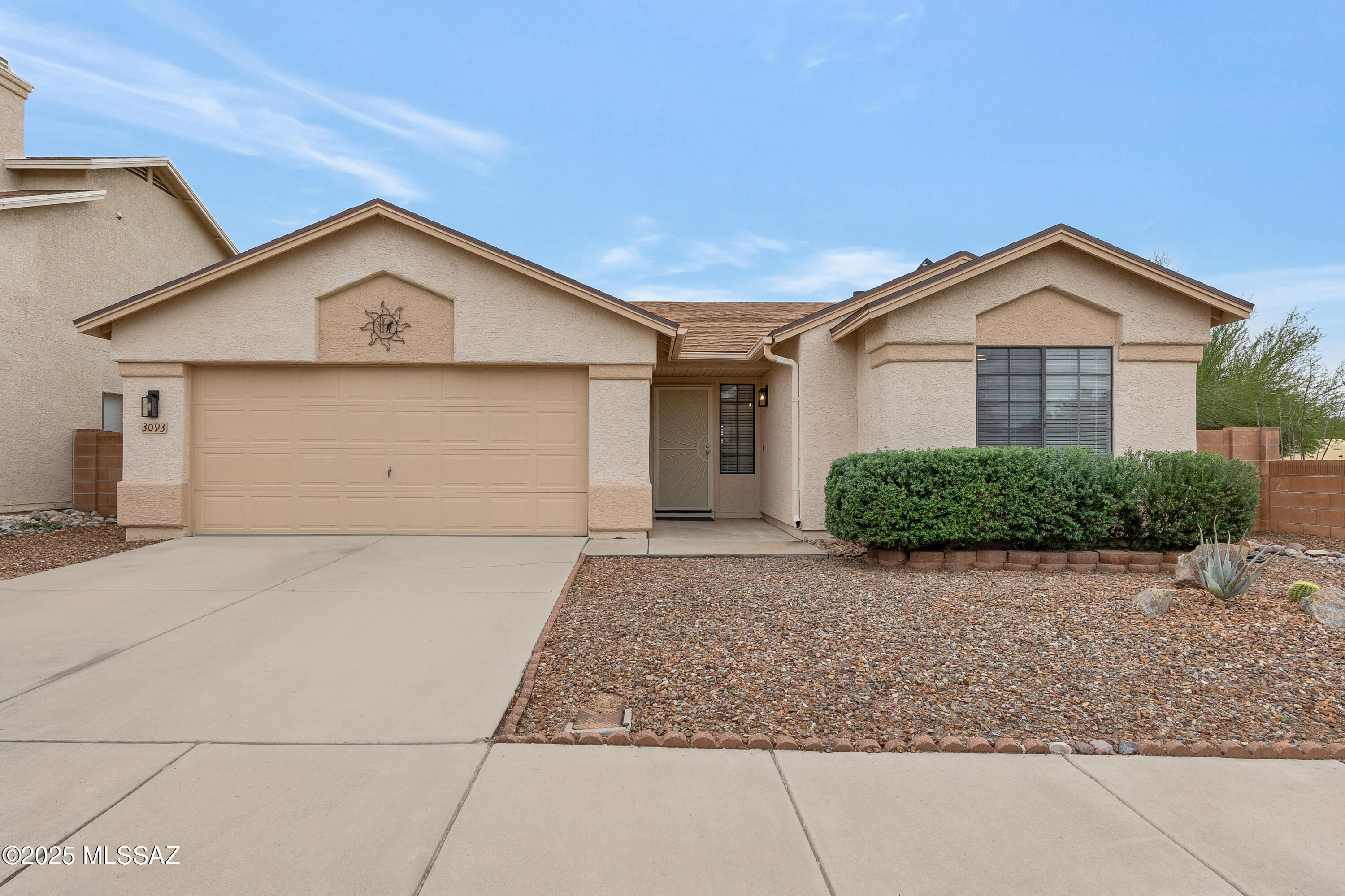 Welcome Home! This well maintained 3 bed/2 bath home is located in a desirable NW Tucson neighborhood that includes a community pool.  Enjoy added privacy on this corner lot.  This open floorplan features vaulted ceilings that fill the home with natural light. The desirable split-bedroom floorplan creates both privacy and comfort - ideal for entertaining or everyday living.  Tile and LVP throughout, no carpet!   Upgrades include no poly pipes and a newer roof. Enjoy a very convenient 2 car garage.  This home is directly across from the Omni Tucson National Golf Resort and is close to shopping, schools, restaurants, hiking trails, interstate access, and more. Discover all this exceptional location has to offer!