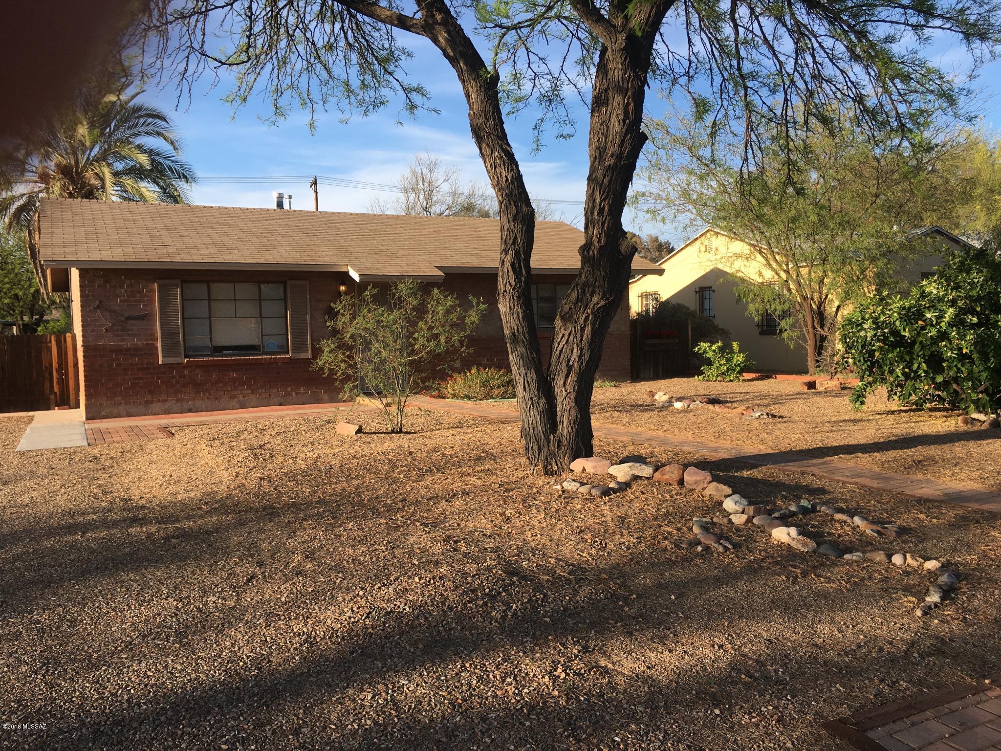 Welcome home to this centrally located double brick home, featuring 2 bedrooms and one full bath that has been remodeled. Tons of cabinets in your kitchen with a gas stove, fridge, new double sinks and dishwasher. Cool AC and nice fenced yard. (NO PETS PLEASE). Easy care flooring, on demand water heater and storage shed. Water usage up to $75.00 per month included in rent. Front yard and side yard maintenance included in rent. Close to shopping, restaurants, entertainment and the University.