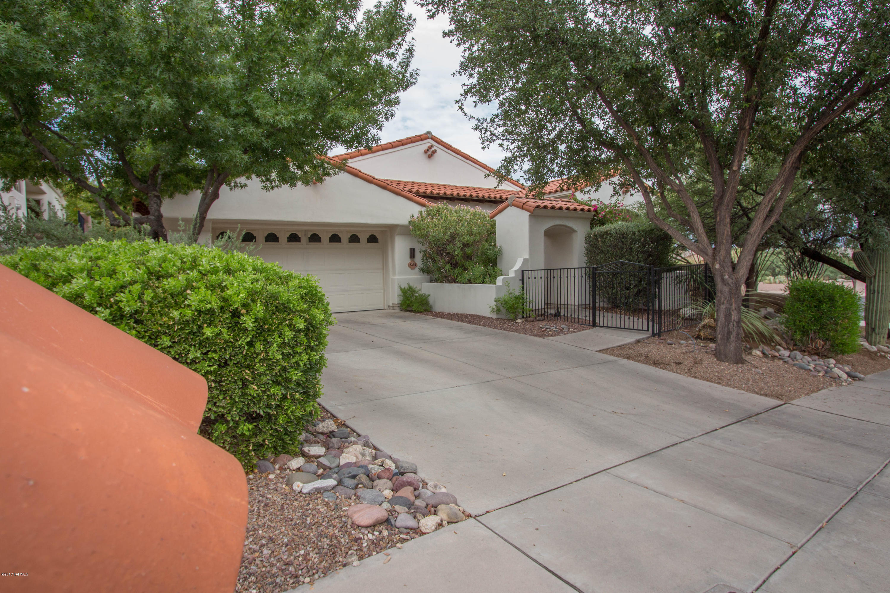 Beautiful, Quality Built Home On Private Corner Lot! Meticulously Maintained! 2 Master Suites. Custom Kitchen Appliances, Dual Oven, Island With Prep Sink, Bar. Custom Window Treatments. Outdoor Living At It's Finest! Front and Extended Back Covered Patio's With Ceiling Fans, Gas Grill HU & Commercial Grade Misting System For Year Round Outdoor Enjoyment. Resort Like Yard With Natural Area Behind. Spool With Waterfall. Spectacular Views! Lush Landscaping, Citrus Trees, Raised Garden Bed, Irrigation. Expanded Finished Garage With AC, Exercise Area, Extra Storage, Built In Work Area With Cabinets. Large Laundry Room With Sink. Security System Installed. Dual Zone AC/Furnace. Gated Golf Course Community W/Restaurant, Pool, Spa, Fitness Center. AHS Warranty In Place. Very Comfortable Home!